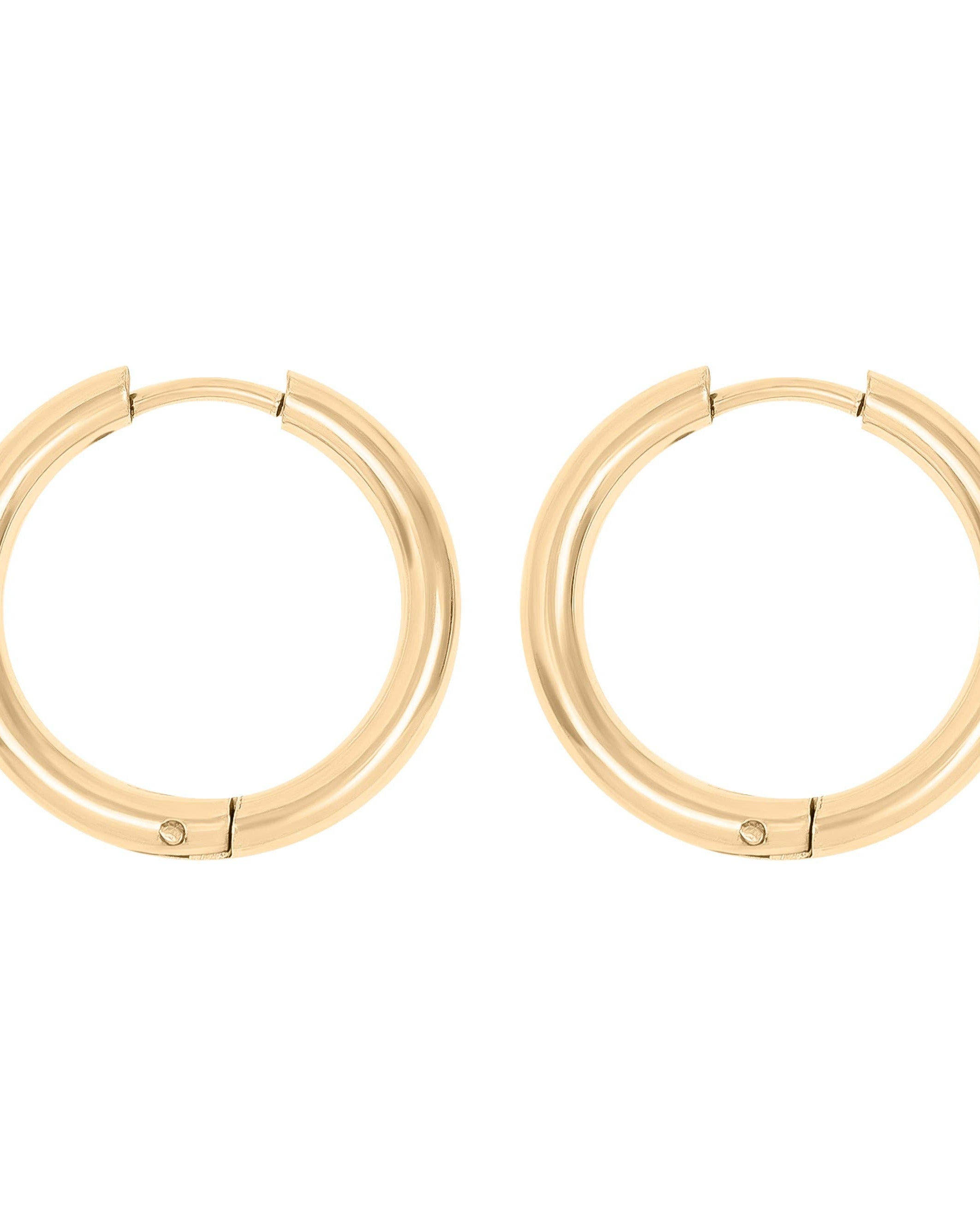 Gold hoop earrings on a white background