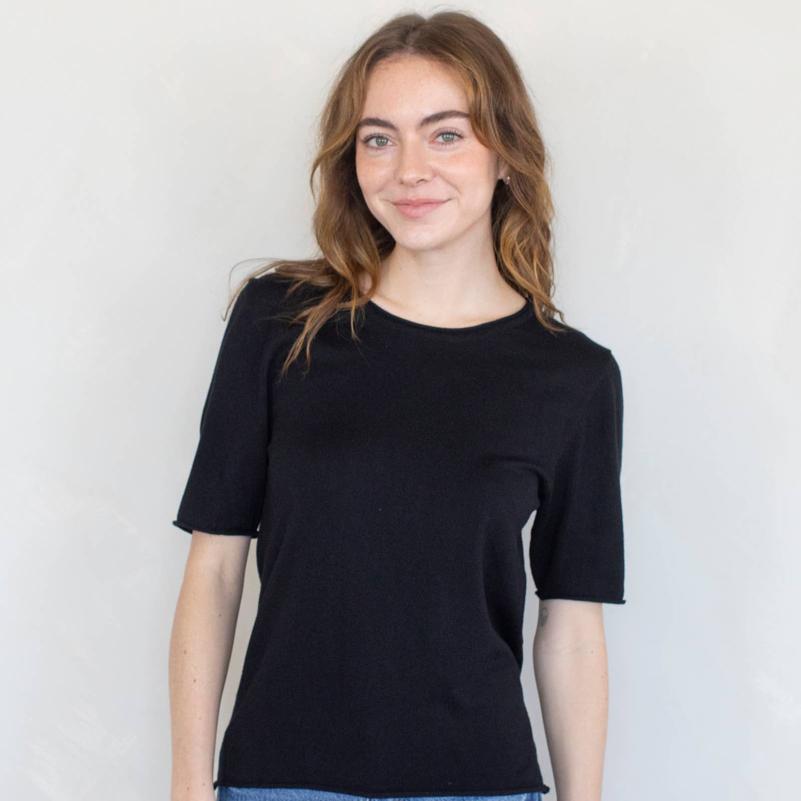 model wearing black t-shirt sweater
