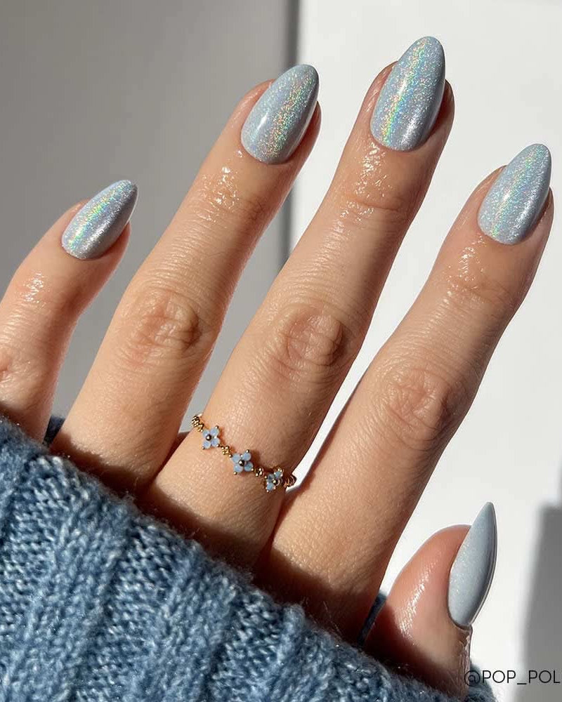 Close-up of short round Azure Blue press-on nails, solid color finish