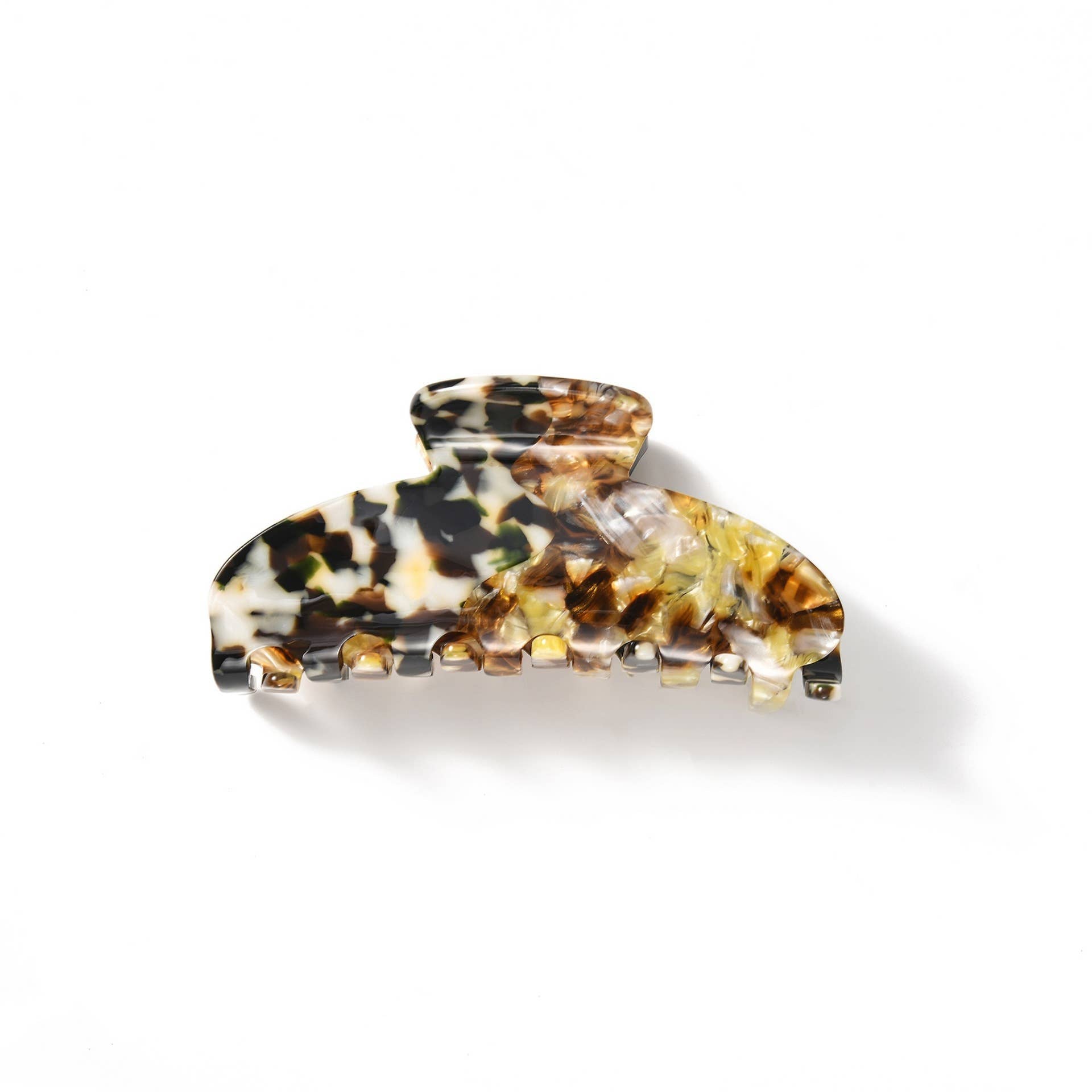 Two tortoiseshell patterned hair clips on a white background