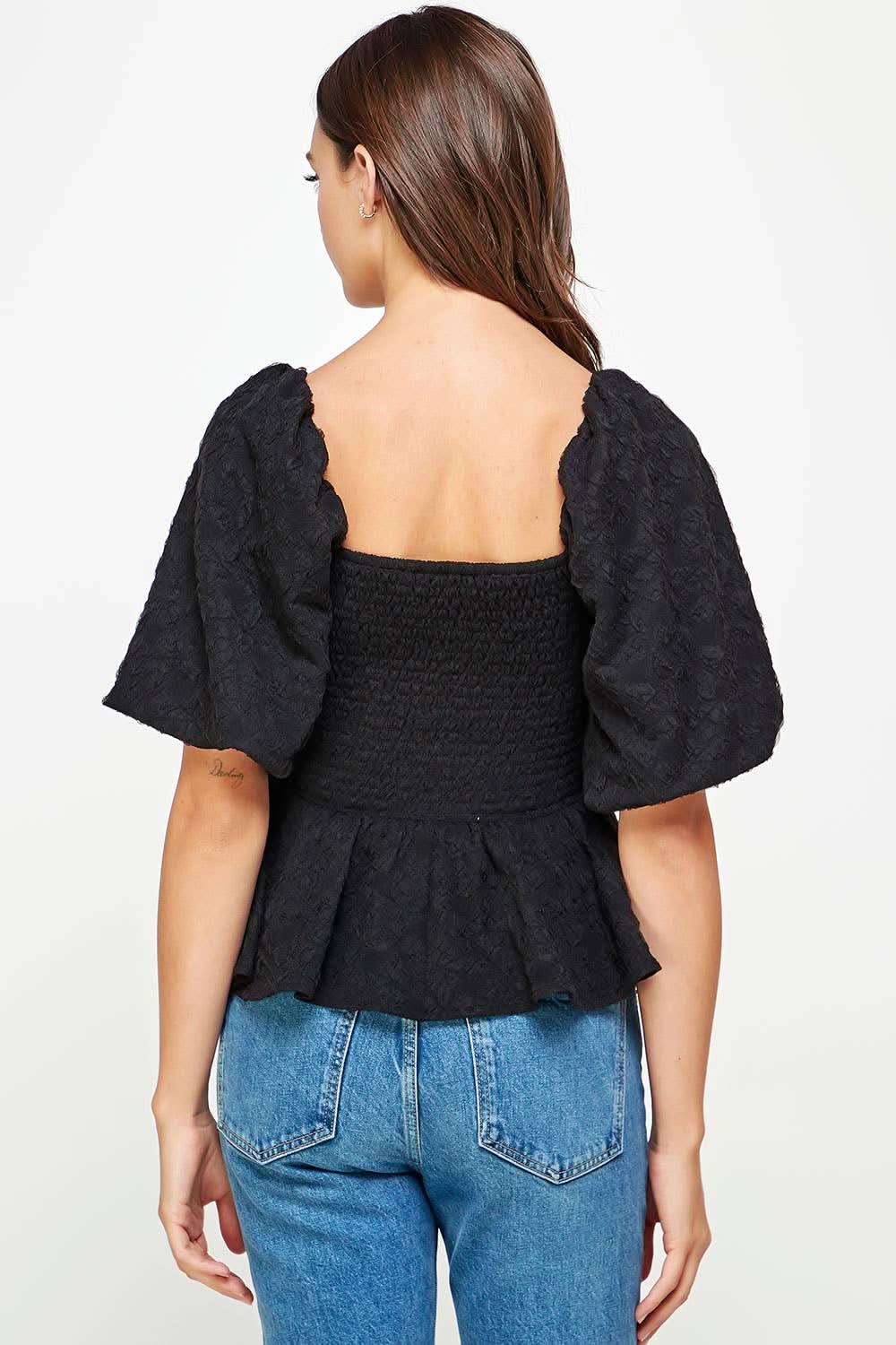 Back view Woman wearing Ballon puffy sleeve ruffle black top