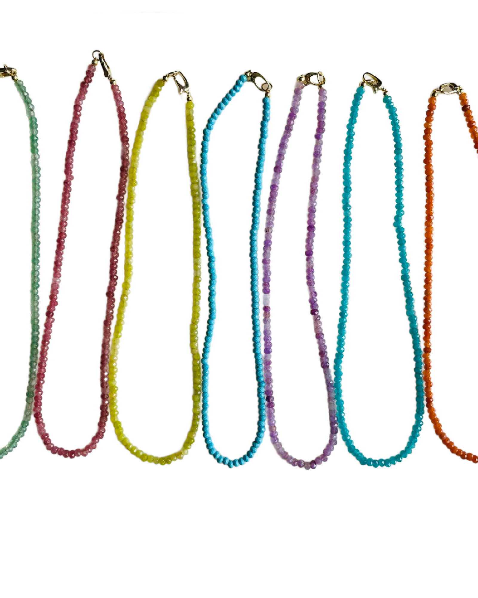 Set of colorful beaded necklaces on a white background