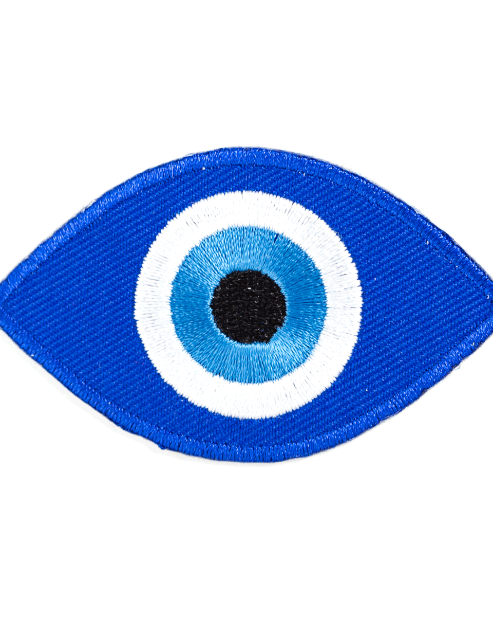 Embroidered eye patch with blue and white design on a white background