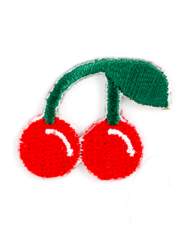 Embroidered patch of two red cherries with green leaves on a white background