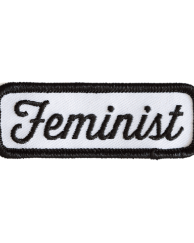 Embroidered patch with the word 'Feminist' on a white background