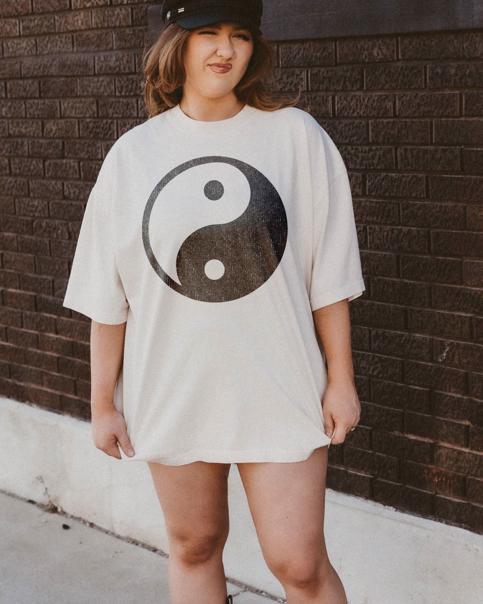 woman wearing hand printed t-shirt with distressed boho Yin-yang design