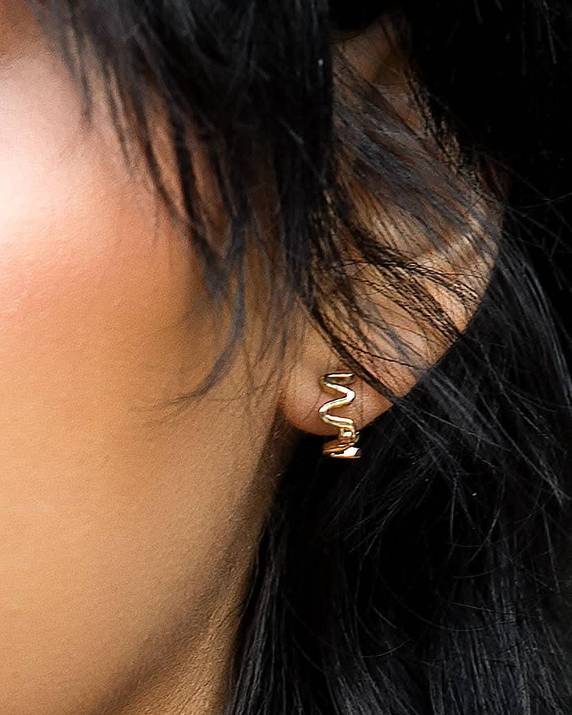 wiggly wavy small gold huggie style hoop earrings