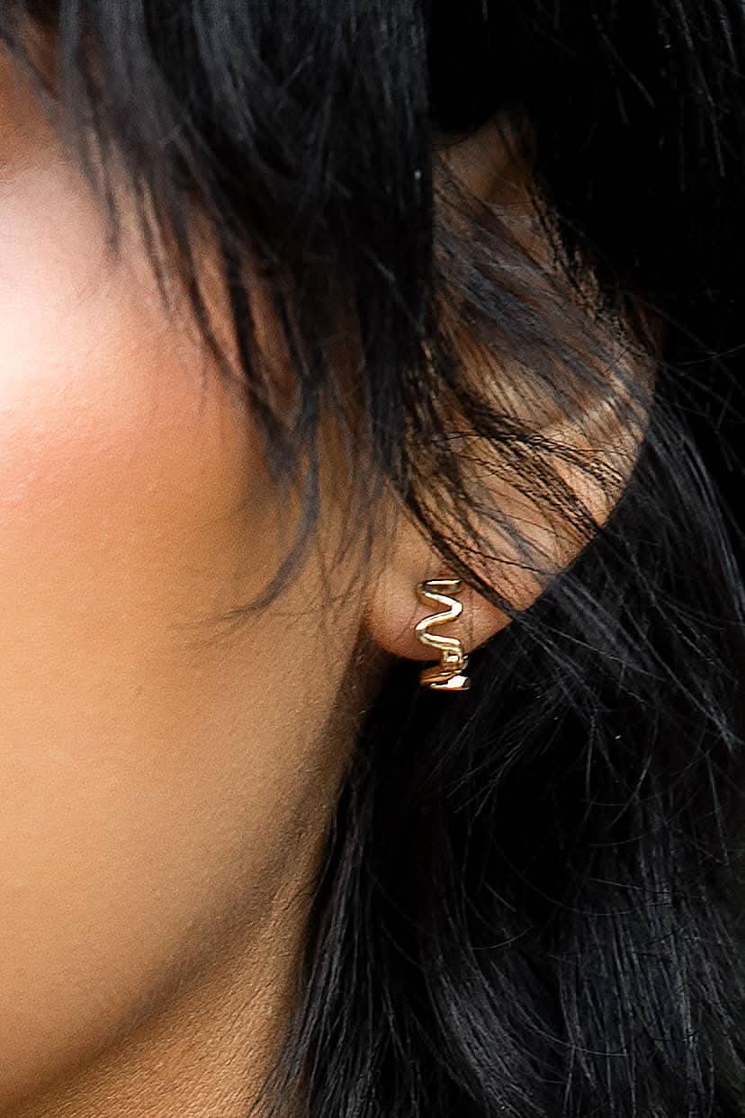 wiggly wavy small gold huggie style hoop earrings