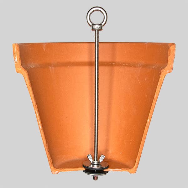 Terracotta hanging planter with a metal hook on a gray background
