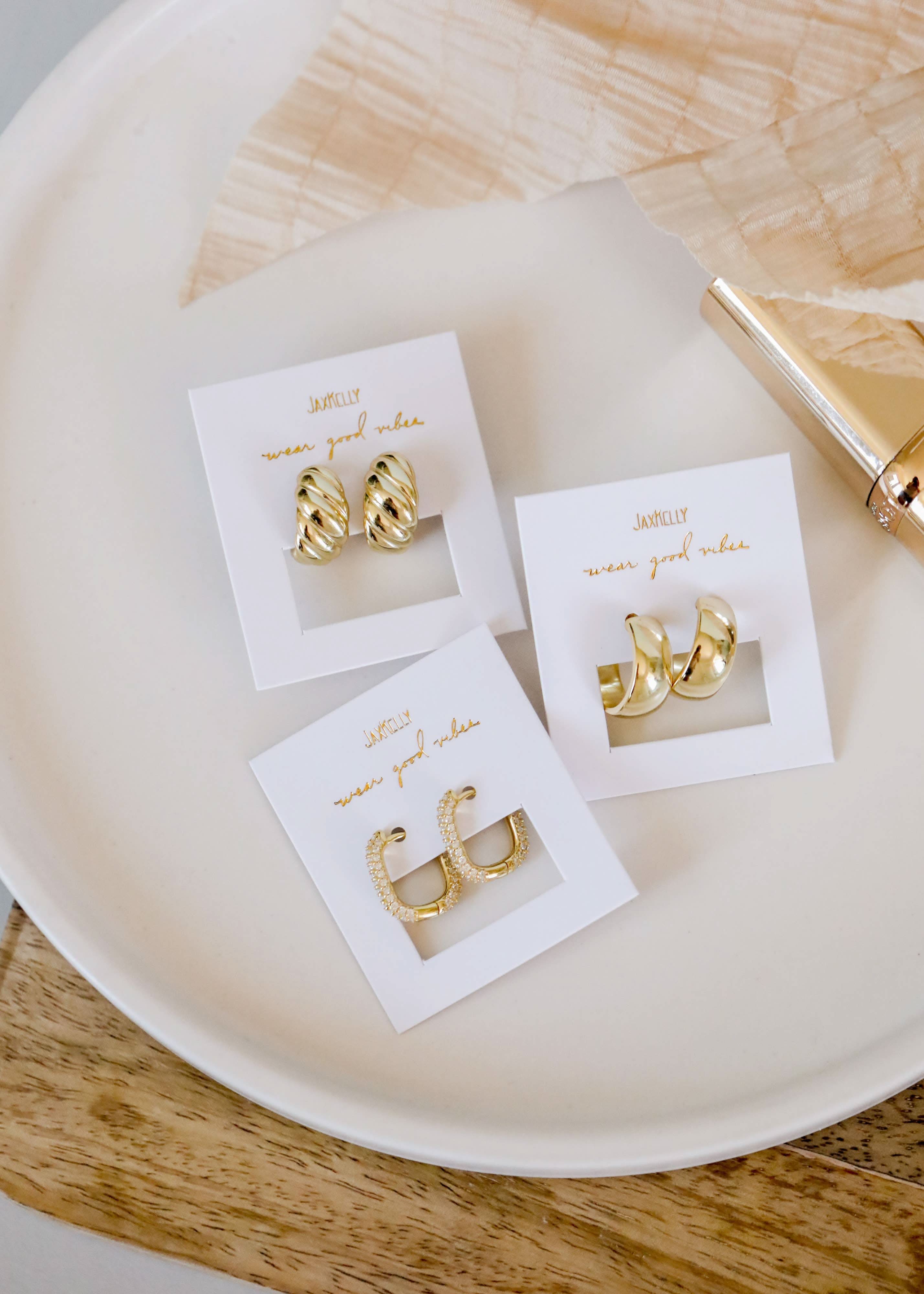 three different Gold Hoop Earrings