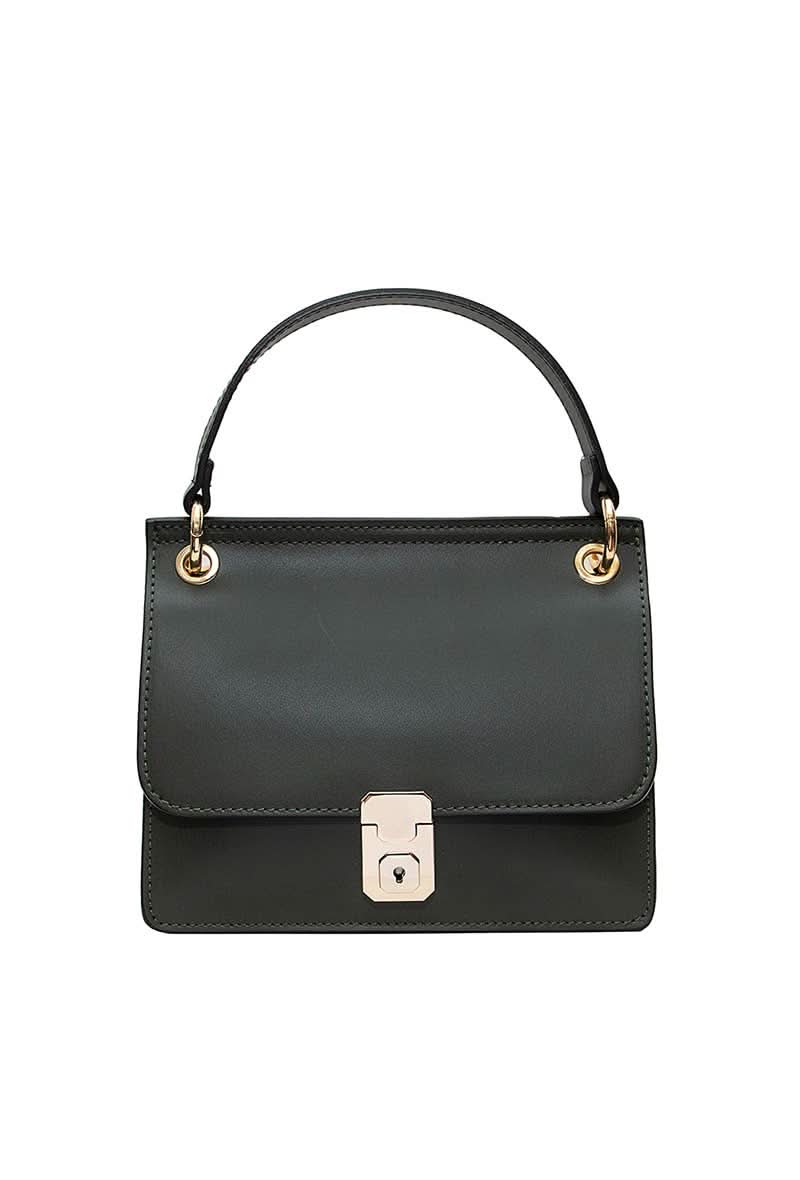 Black leather handbag with gold details and clasp sitting against white background