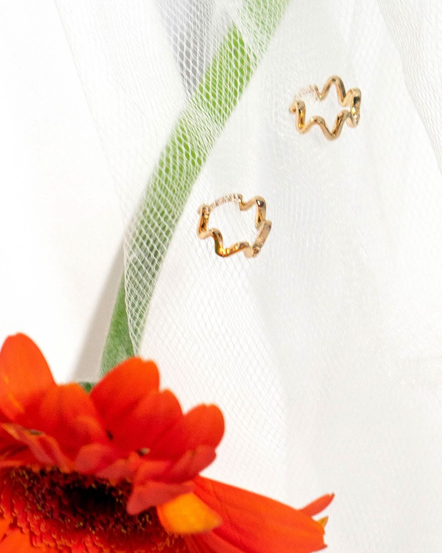 wiggly small gold huggie style hoop earrings