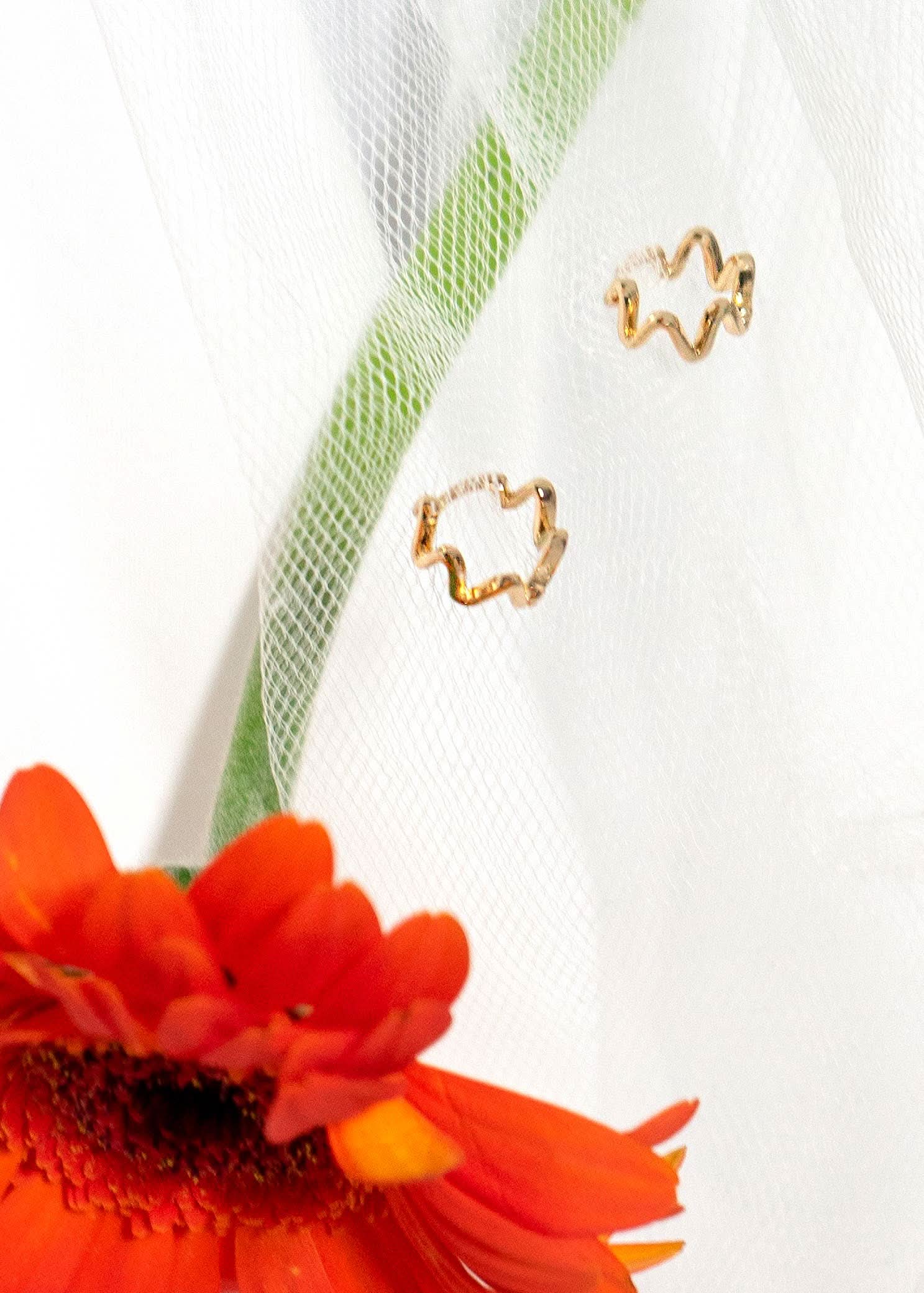 wiggly small gold huggie style hoop earrings