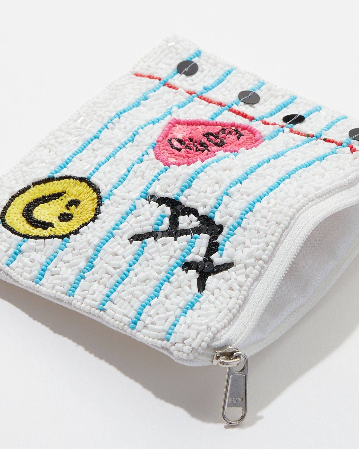 Embroidered pouch with an A plus, heart, and smiley face on a white background