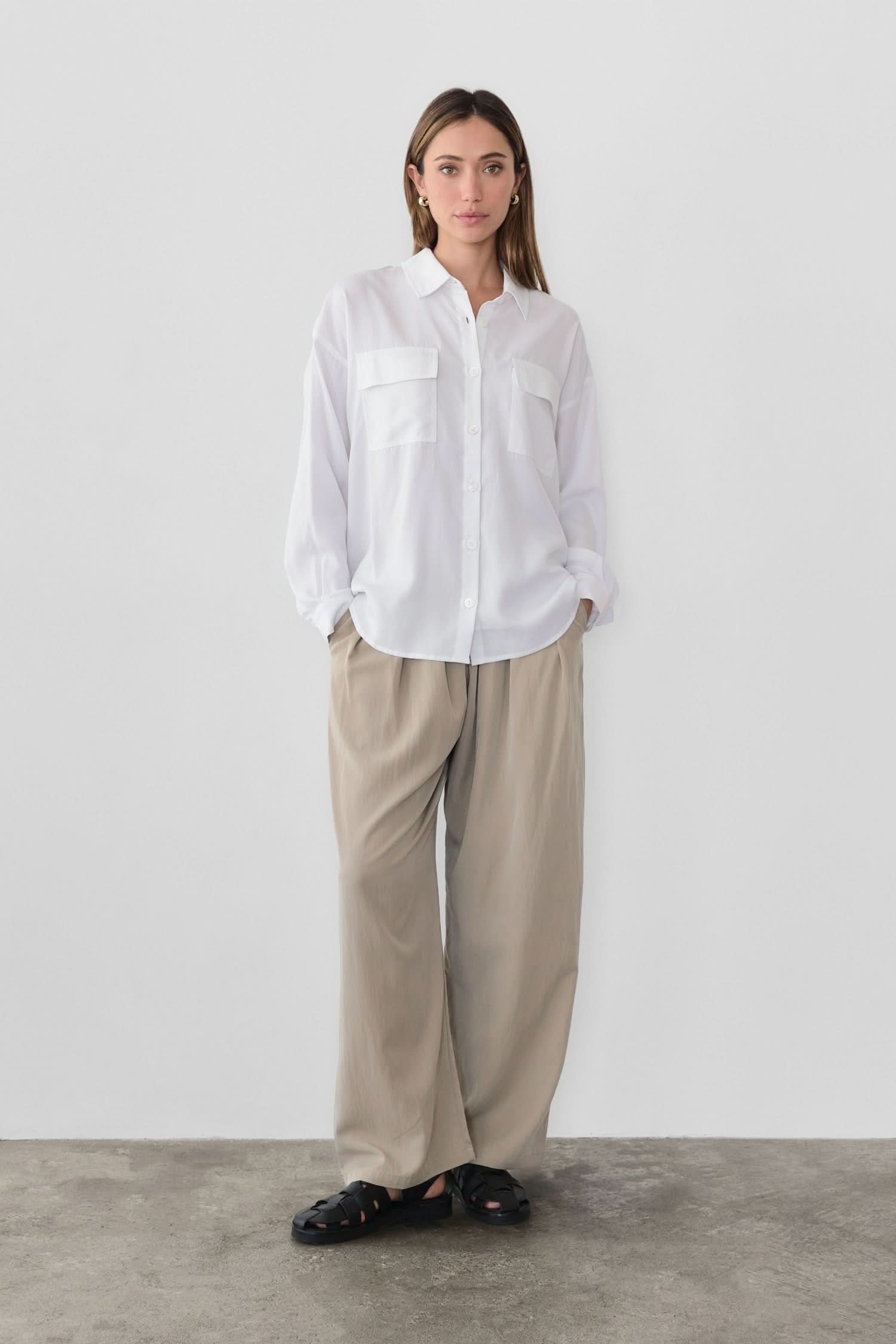 woman wearing oversized classic white button-down shirt