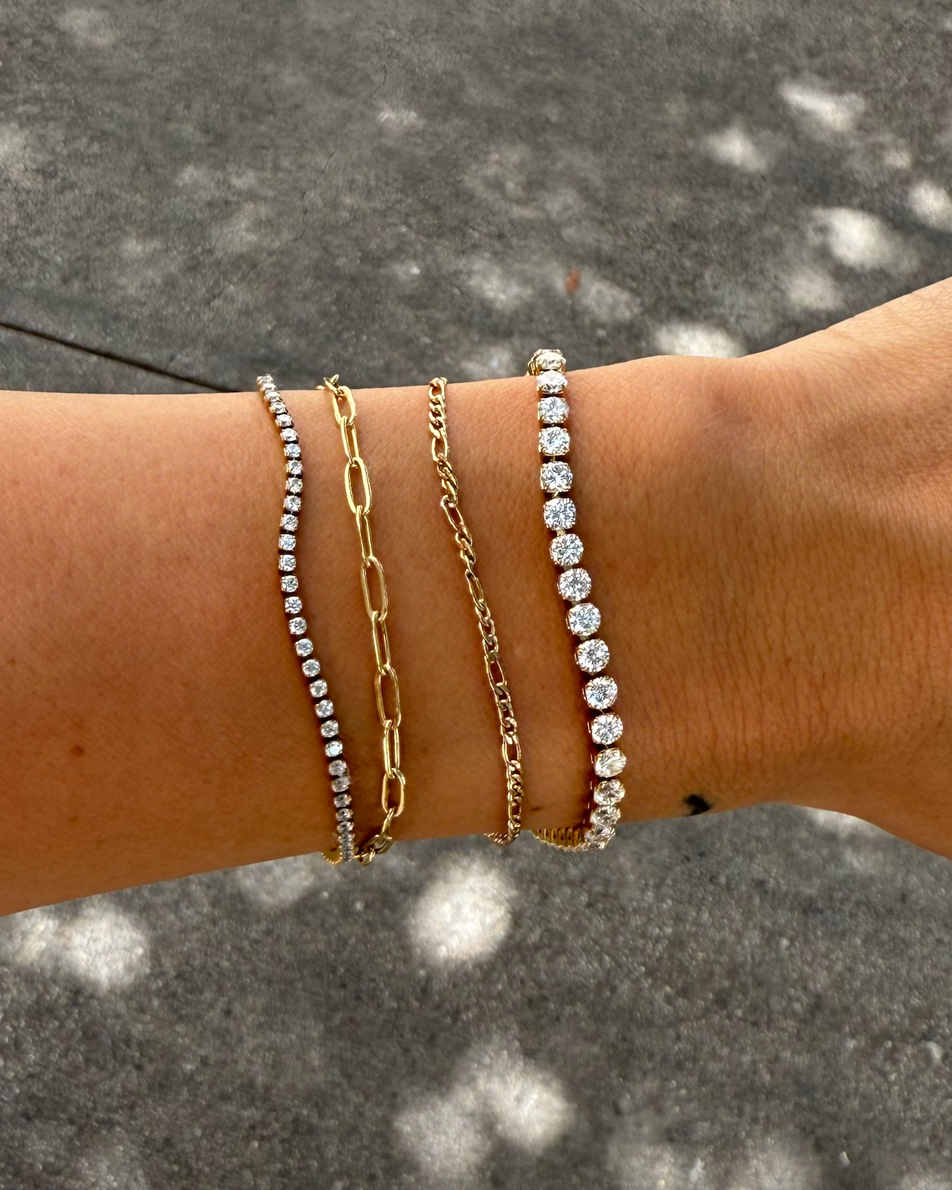 Woman wearing Dainty gold shimmer tennis bracelet