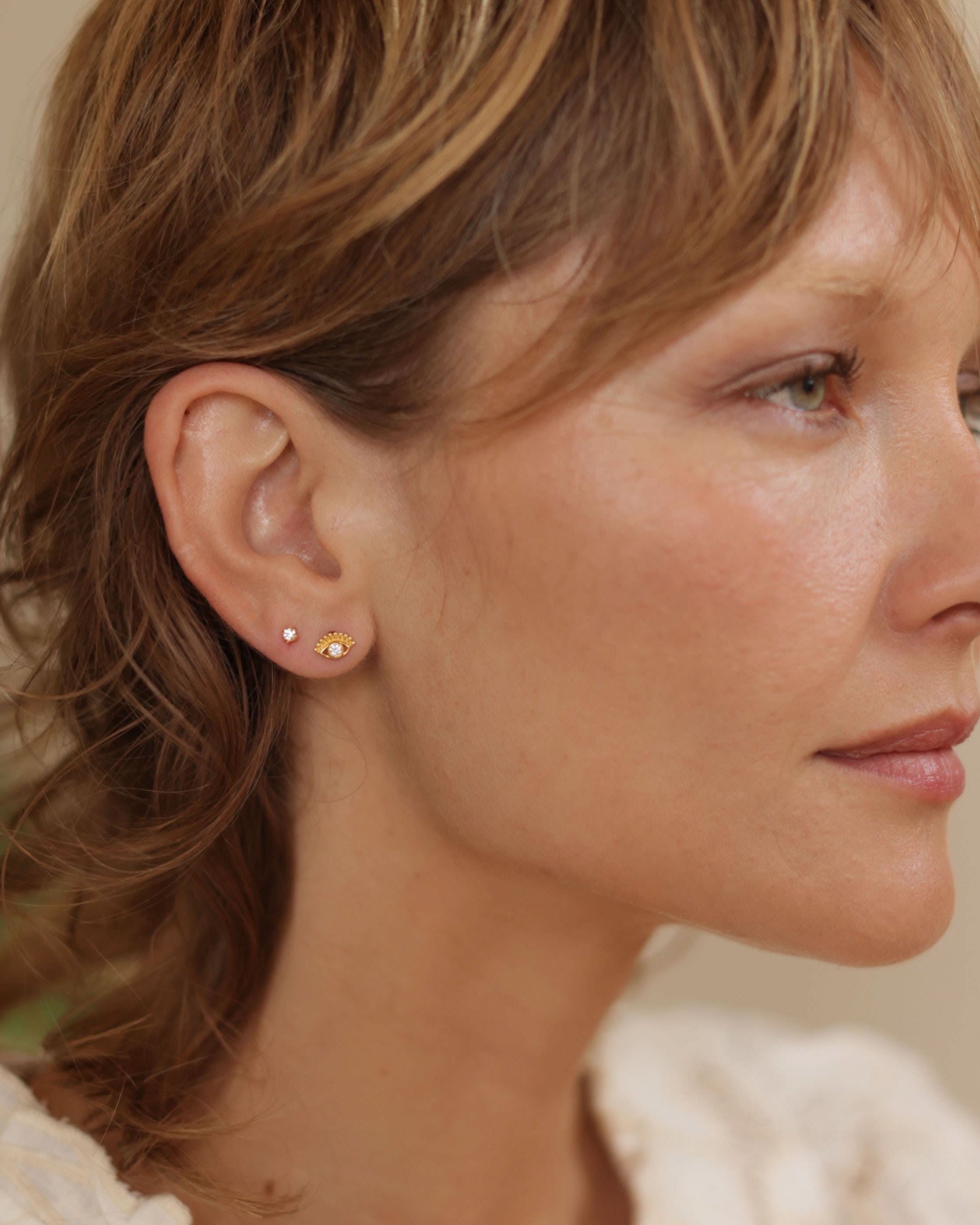 amano studios wearing crystal eye of protection gold stud