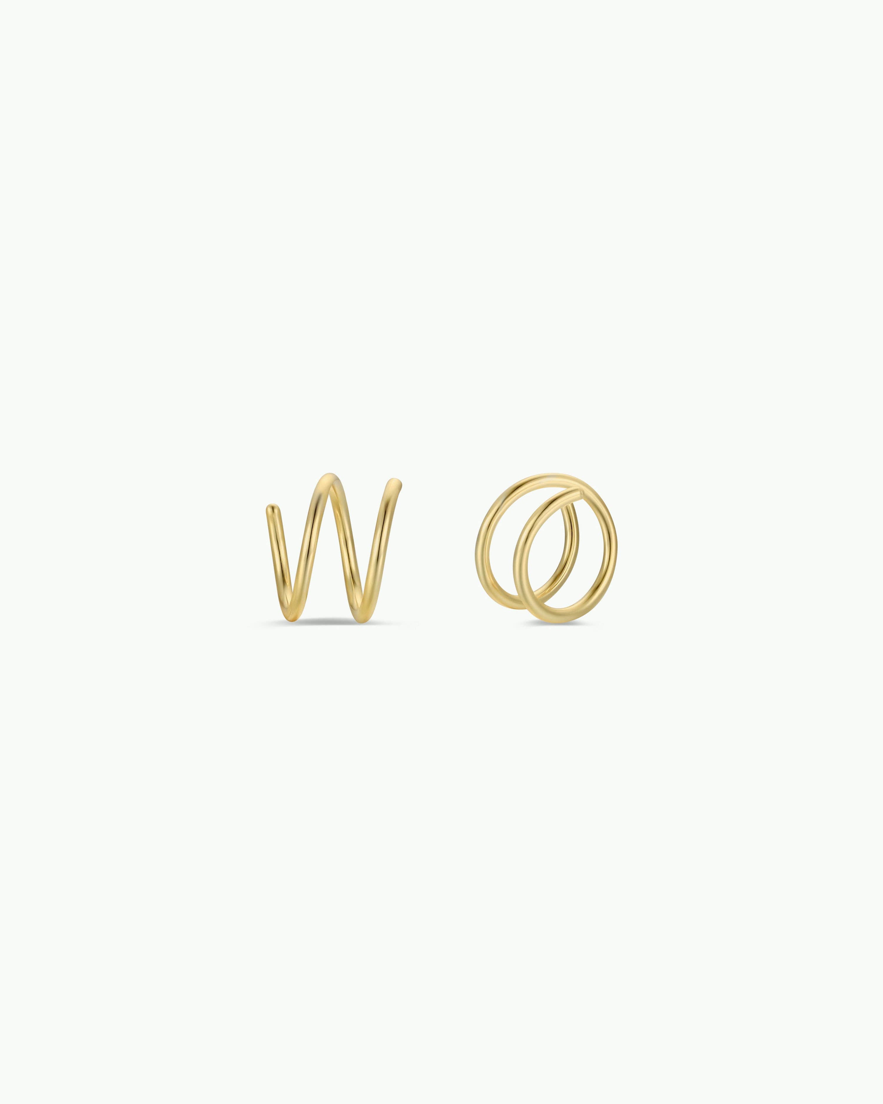 Gold spiral earrings on a white background