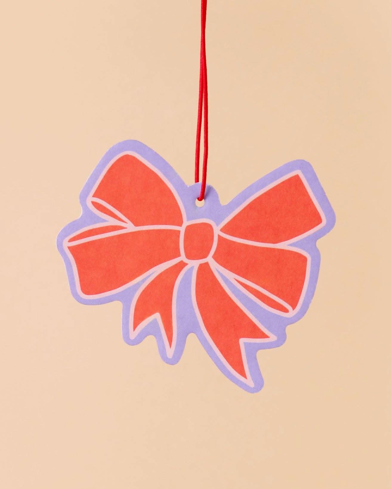 red bow car air freshener with lavender and pink details