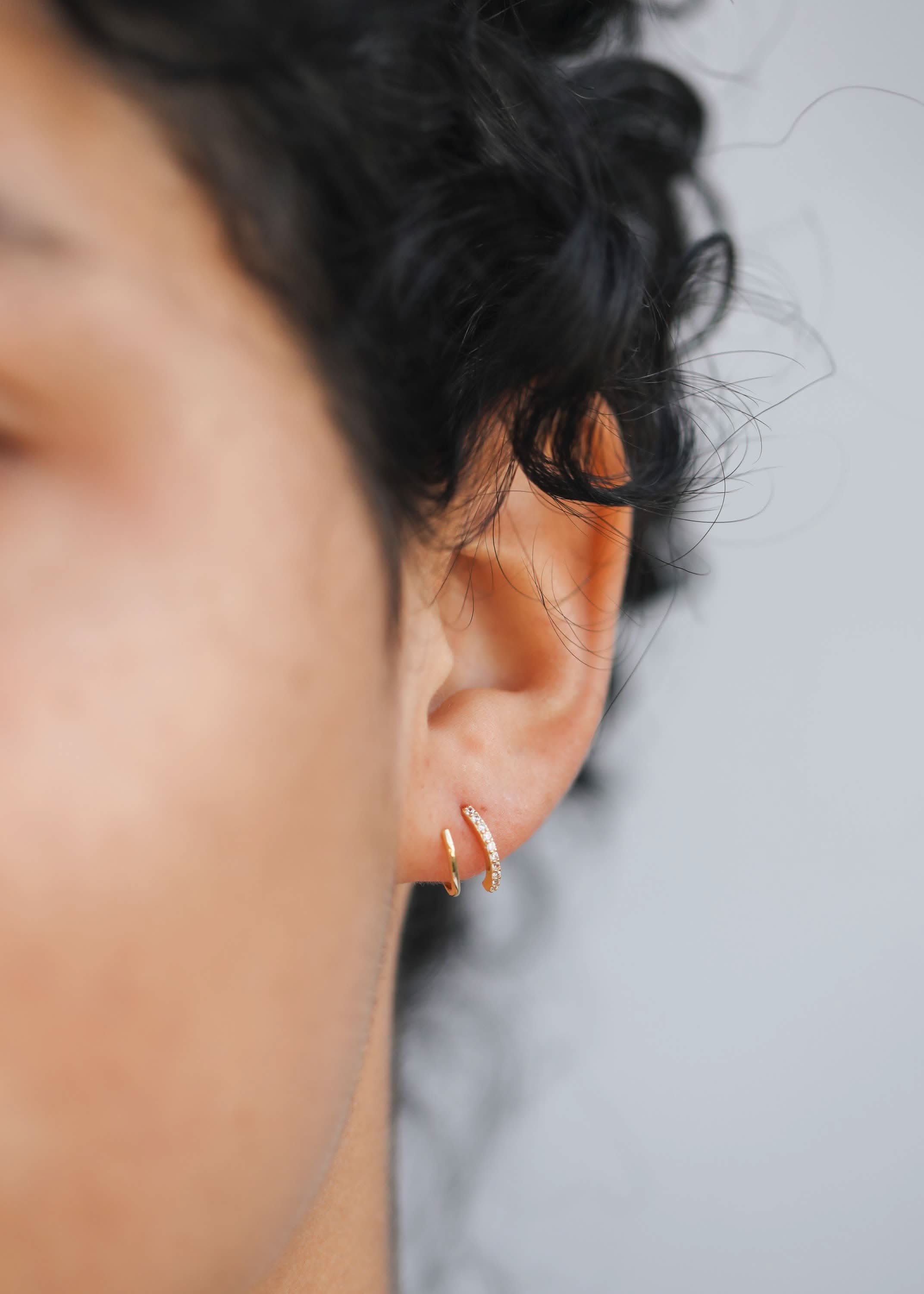Woman wearing Gold pave spiral earrings from Jaxkelly