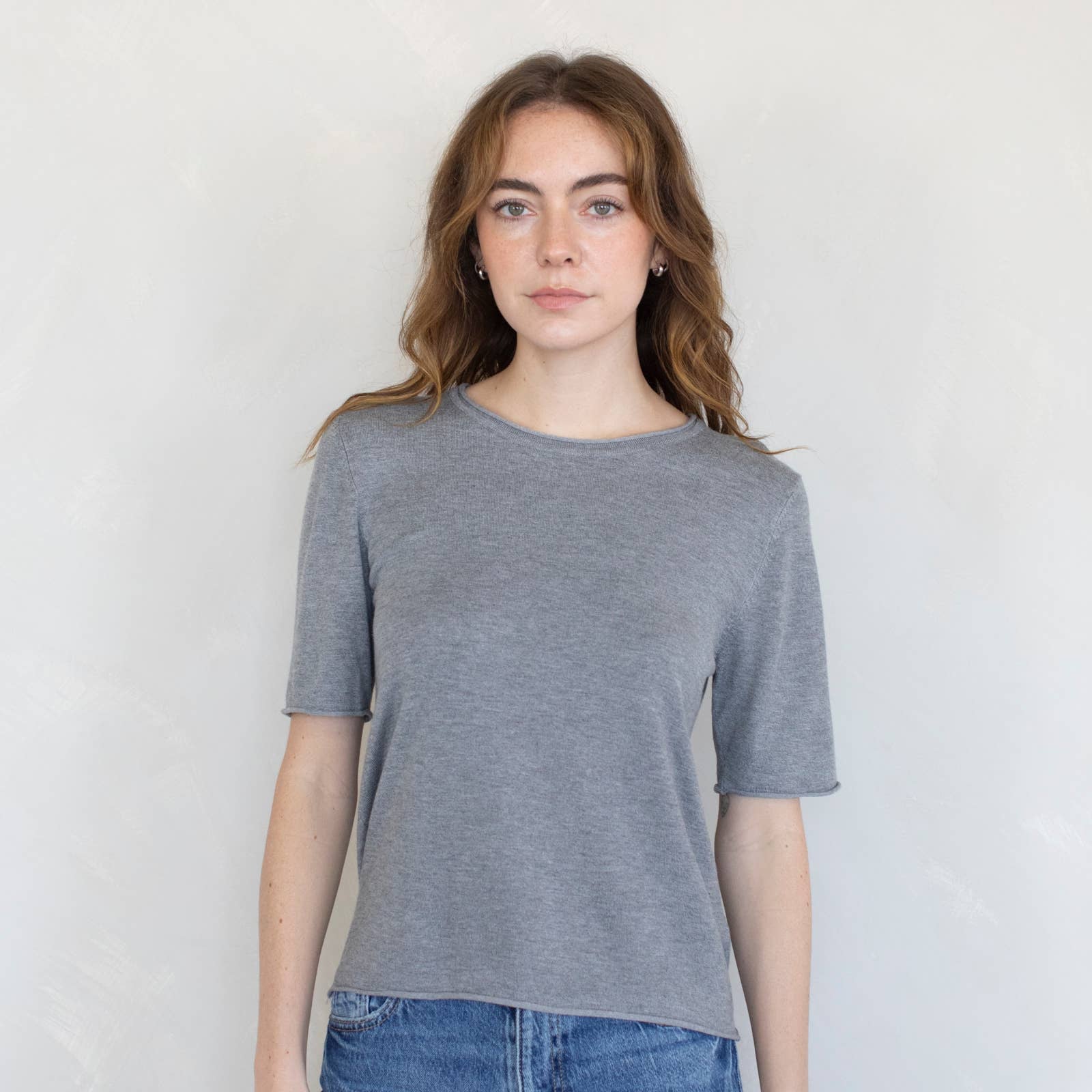 model wearing gray t-shirt sweater