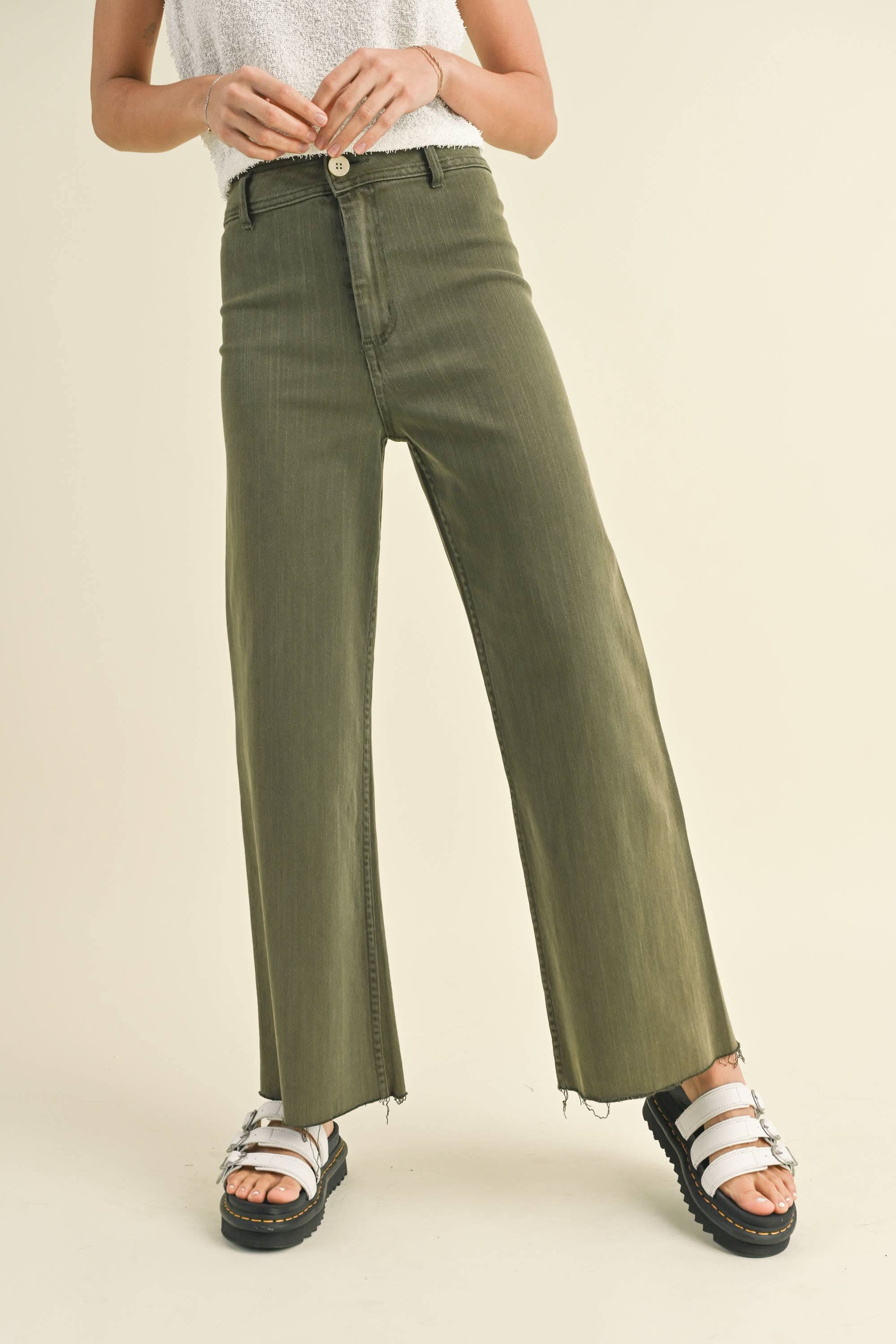 Model wearing green wide leg denim pants with a slight crop, classic shape and convenient back pockets.