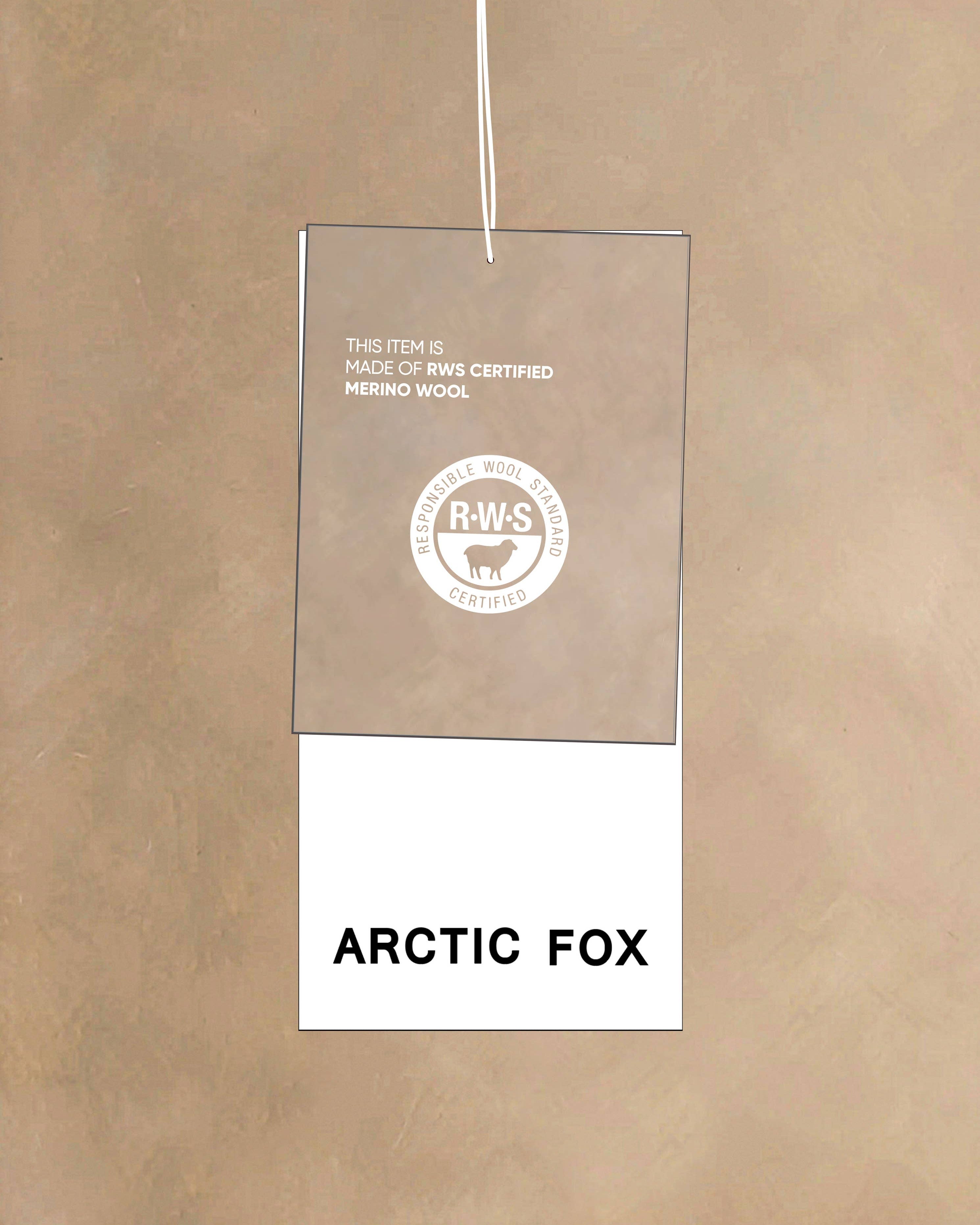 Product tag with 'Arctic Fox' text and a logo on a beige background