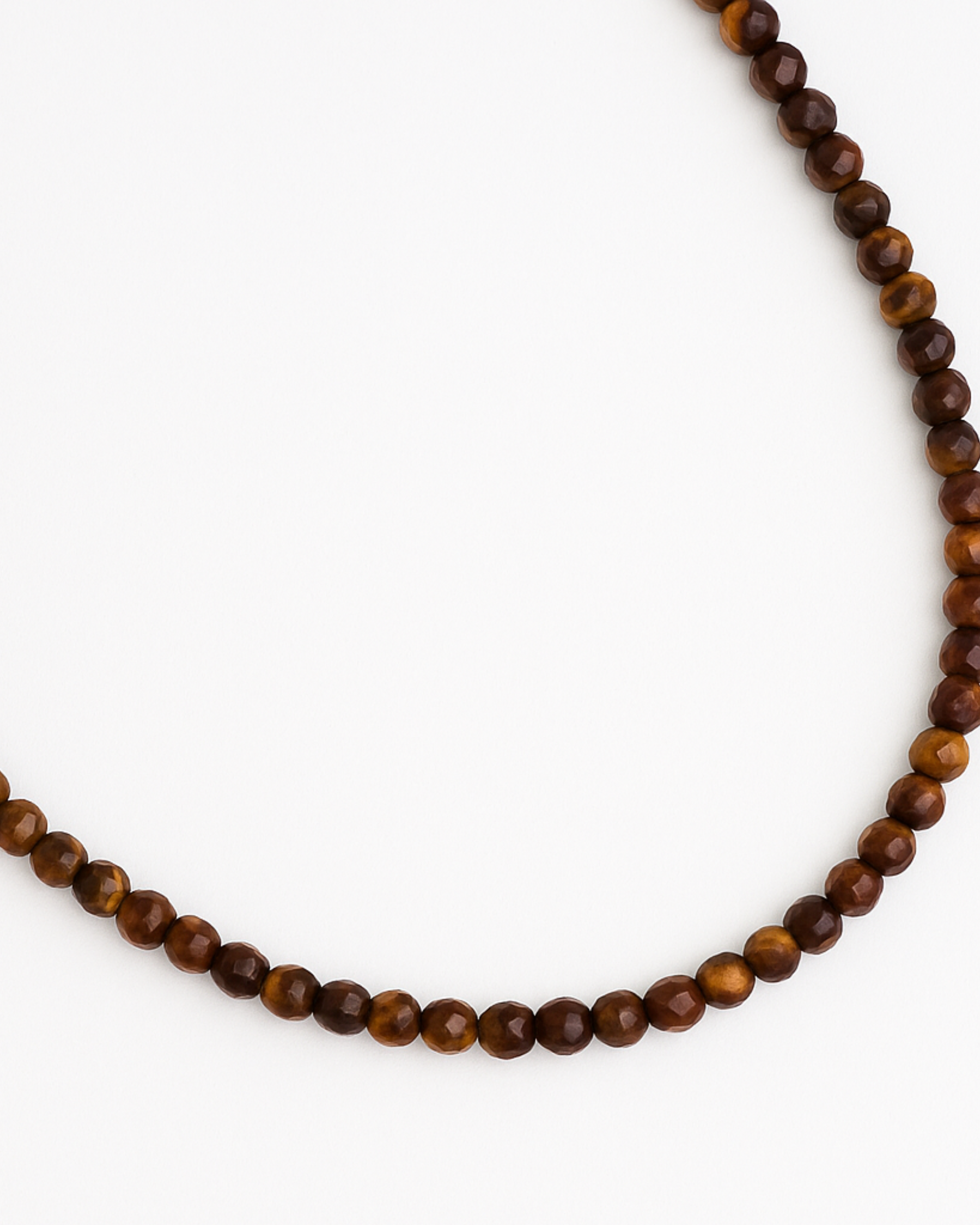 Beaded necklace with brown beads on a white background
