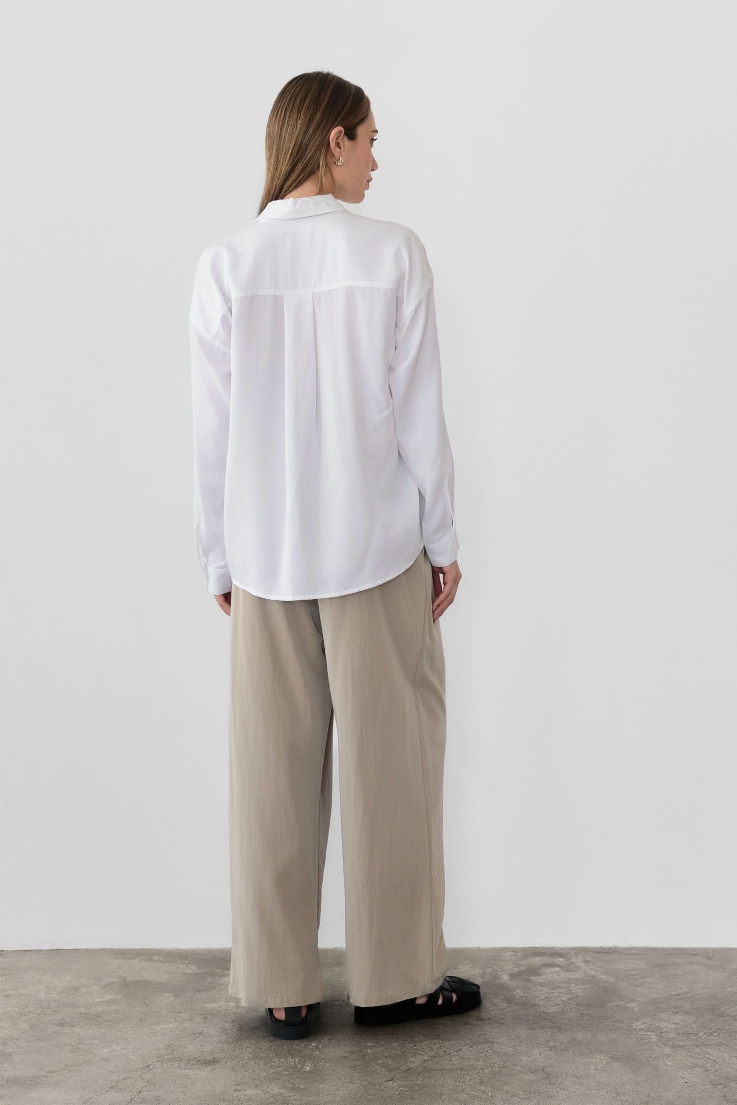 woman wearing oversized classic white button-down shirt
