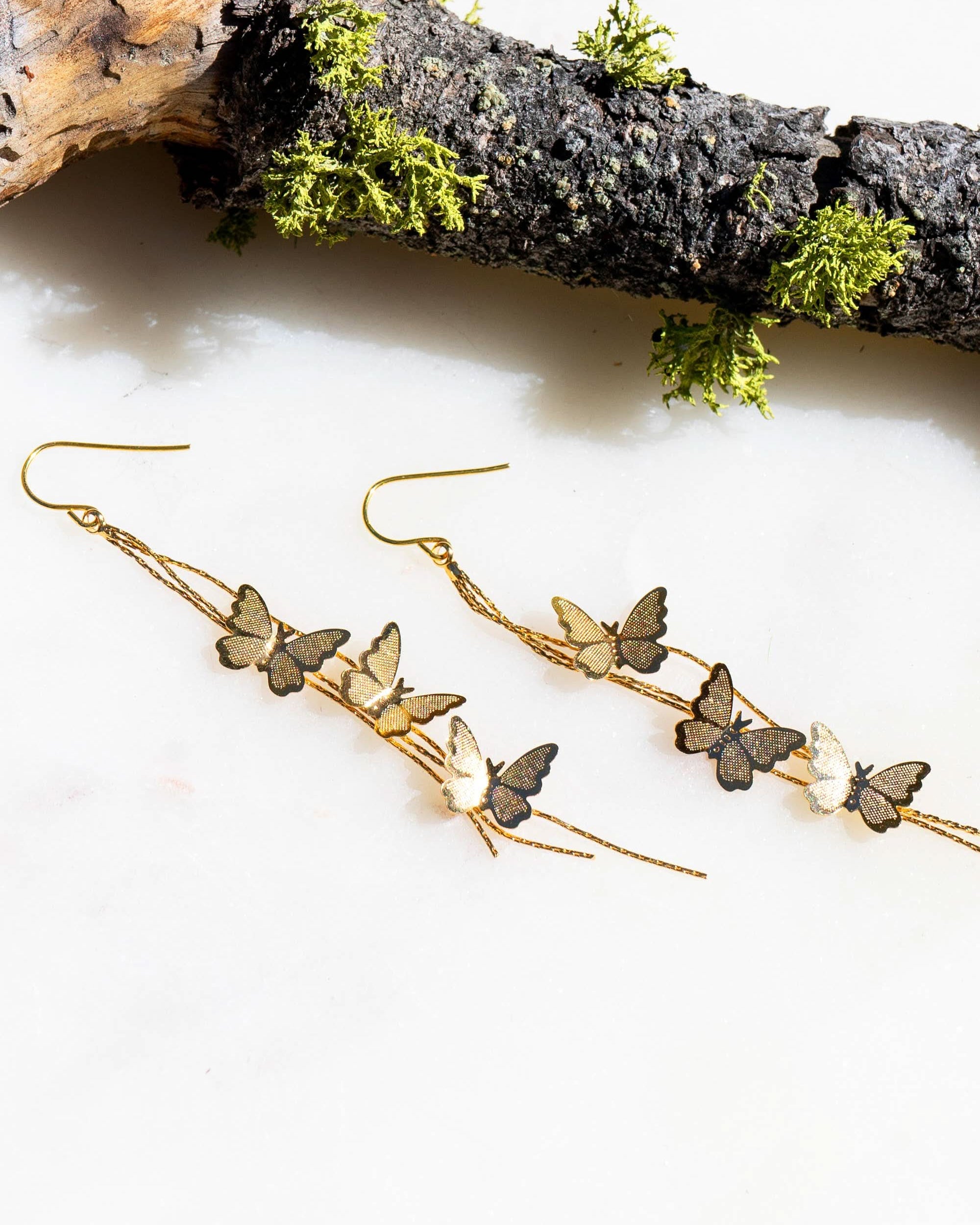 gold butterflies dripping chain earrings