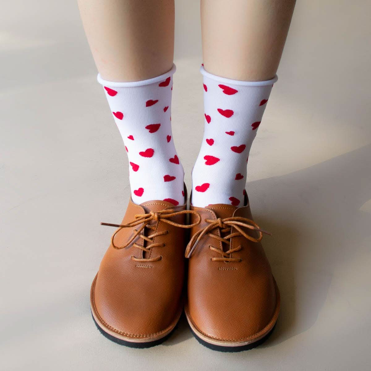 model wearing white socks with red hearts