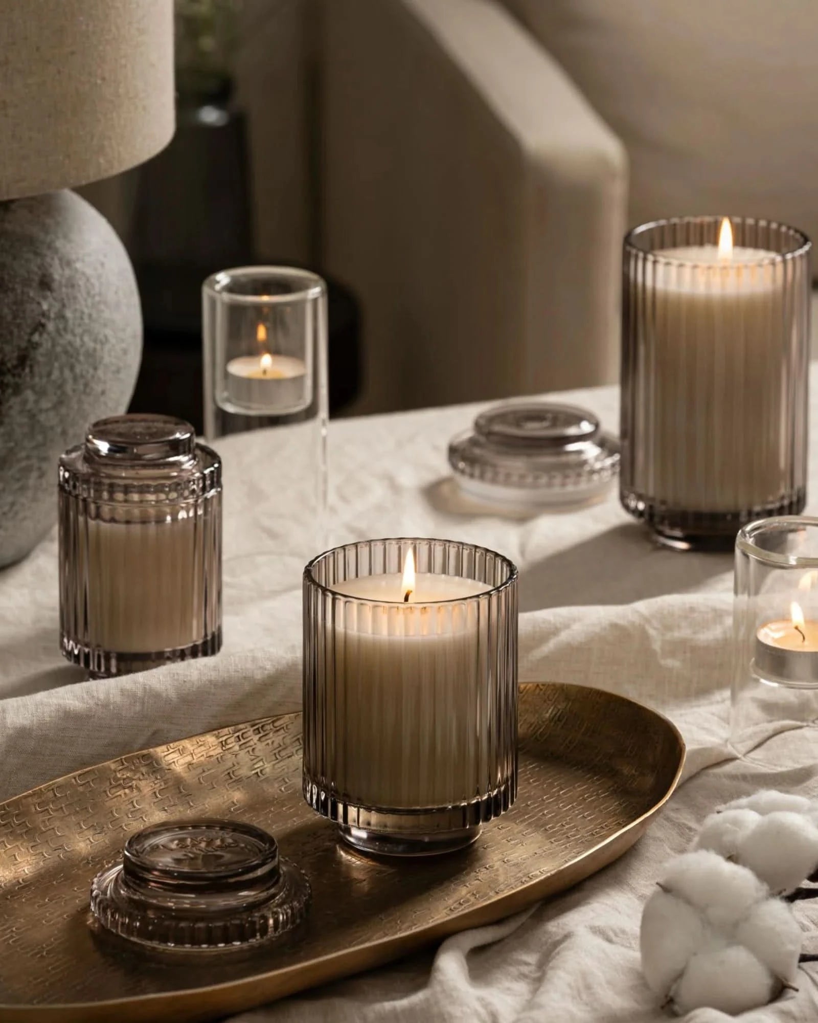 Candle holders on a table with a soft, warm glow