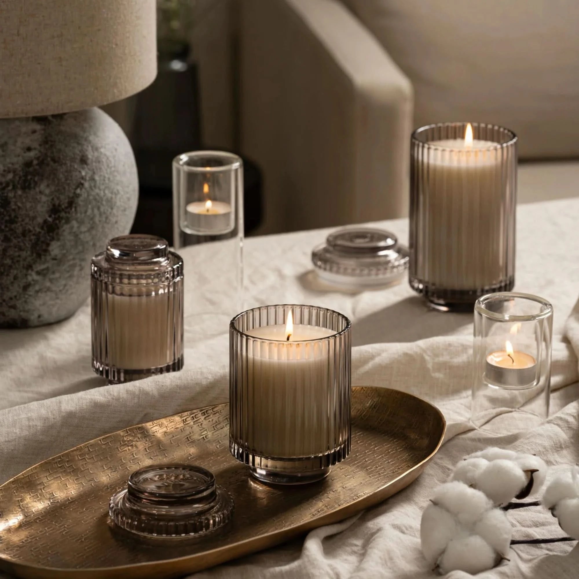Candle holders on a table with a soft, warm glow