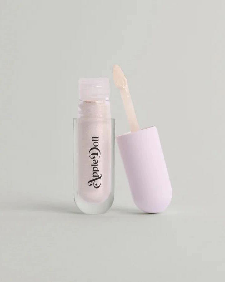 Open tube of AppleDoll Cosmic Aphrodite Crème Shadow pearlescent, shimmering.