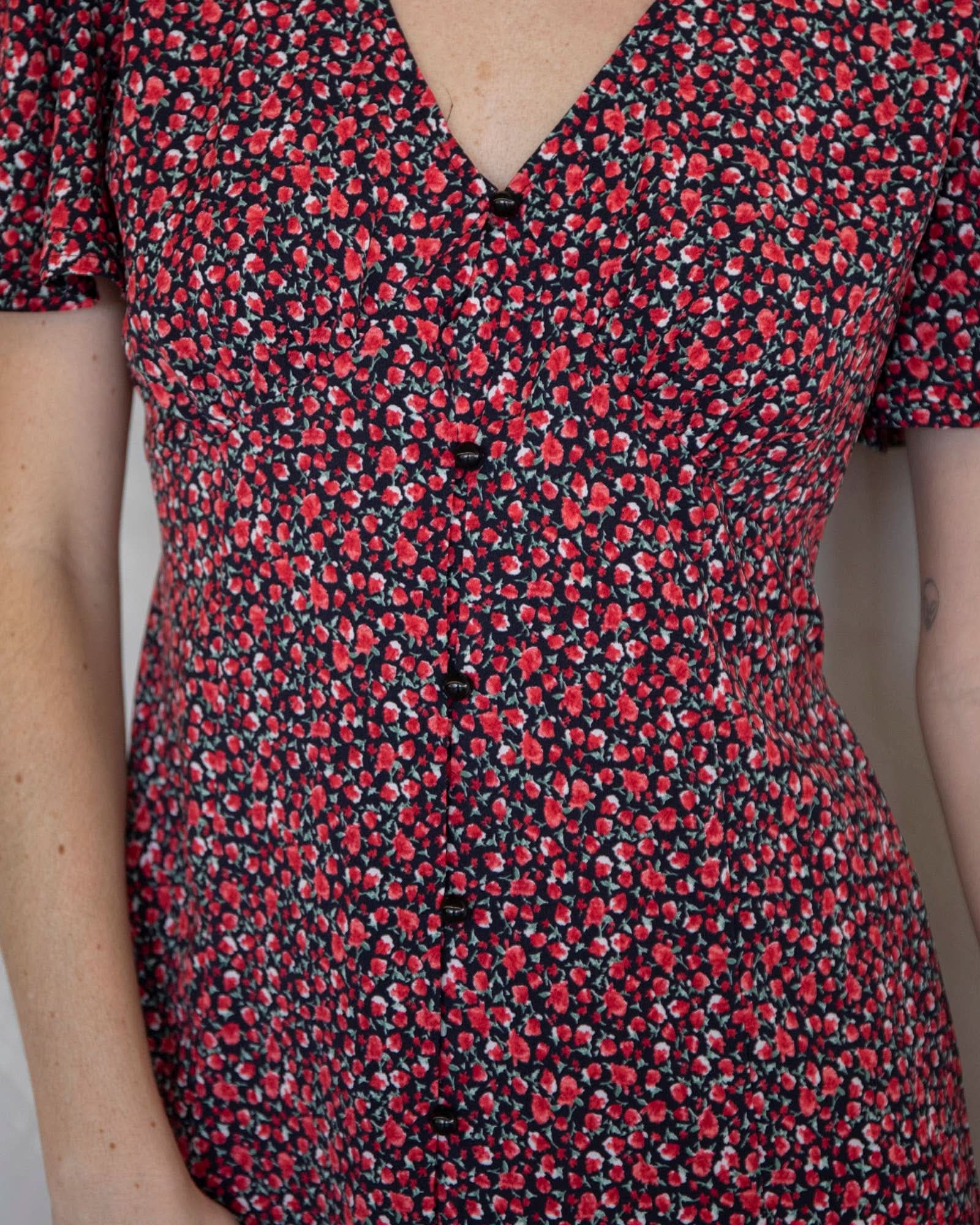 Close-up of a red and black floral dress Ara Mini Dress