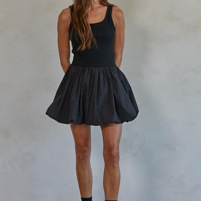 Aster Mini Skort Dress Woman wearing a black sleeveless