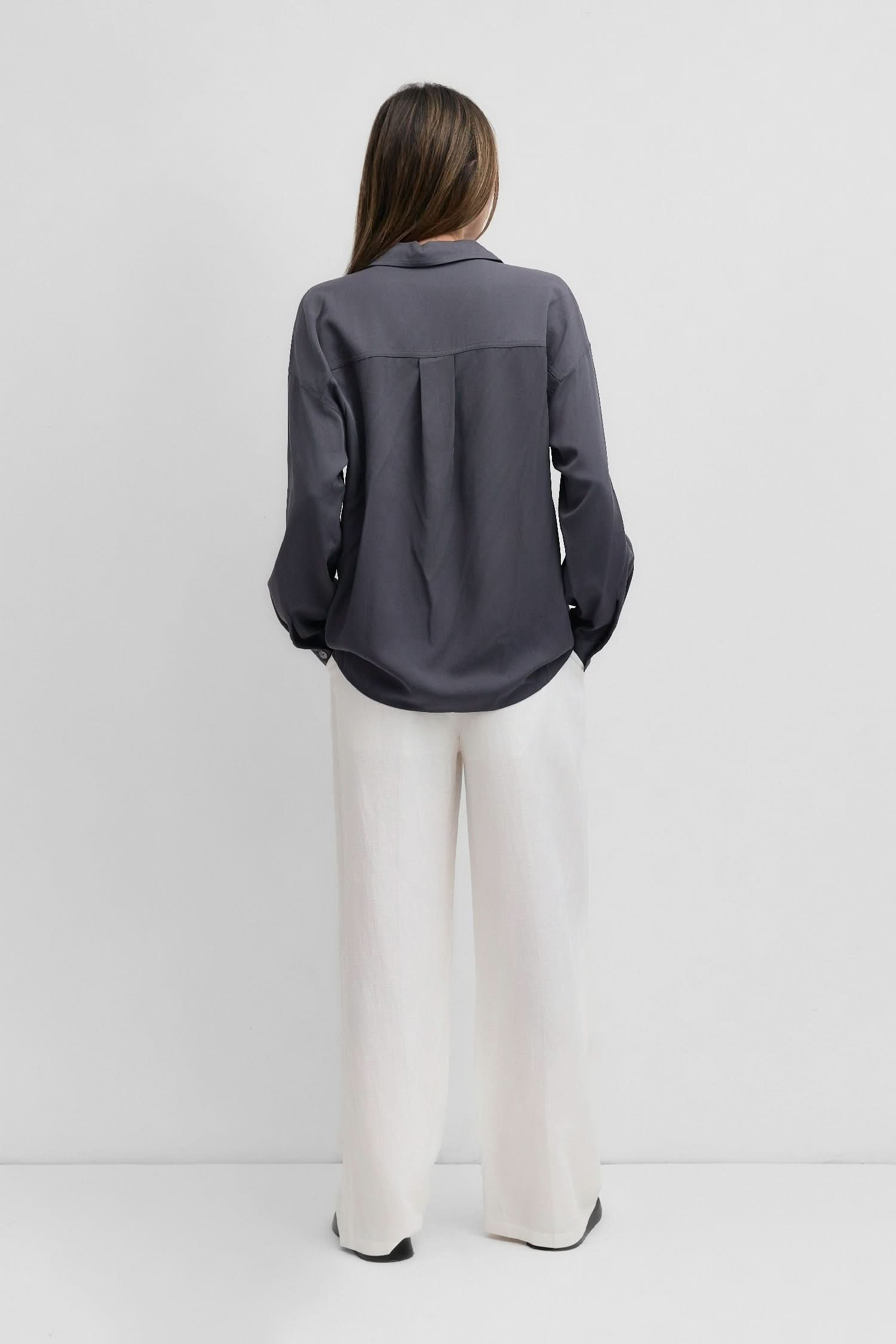 woman wearing dark grey blue oversized classic button-down shirt