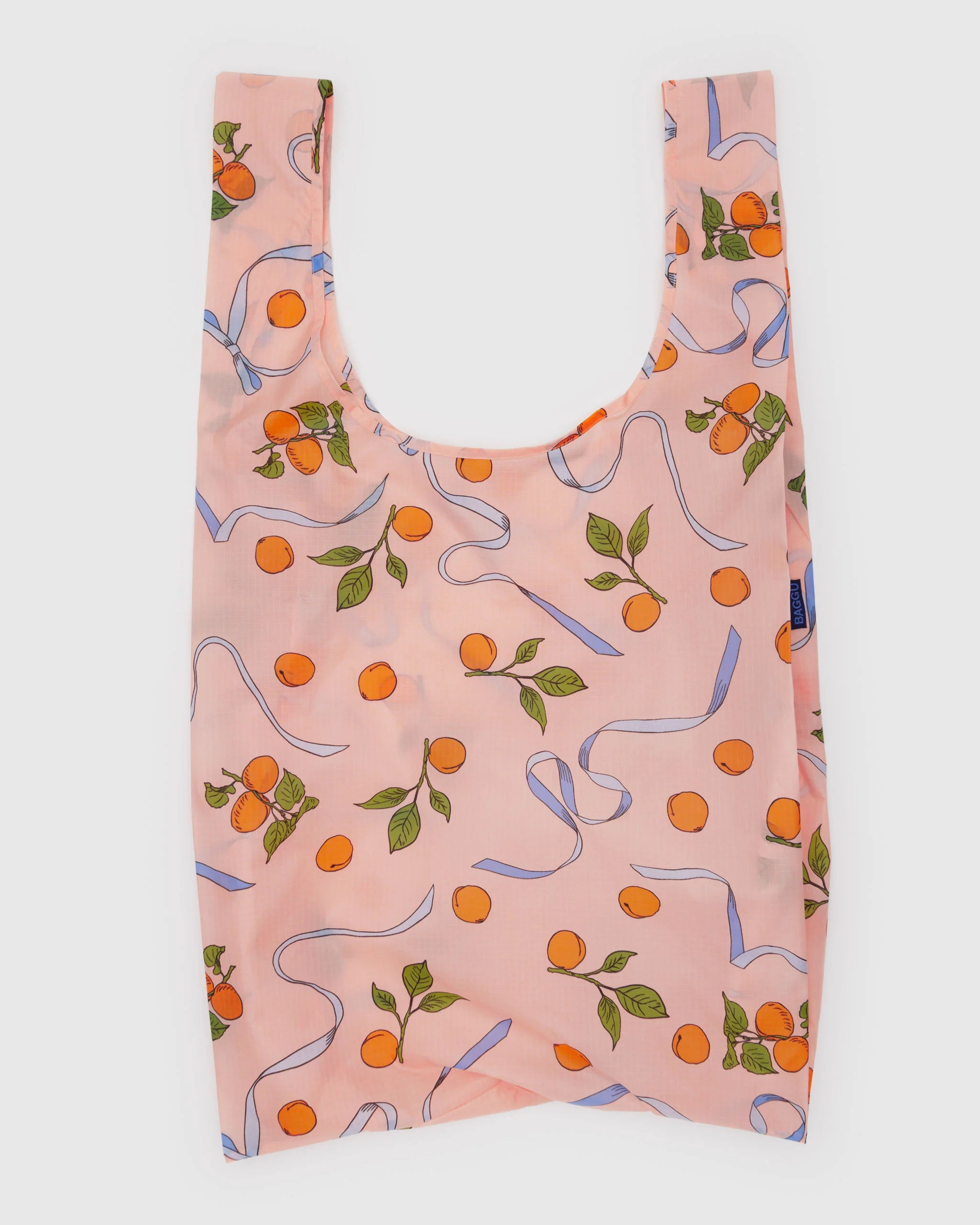 Reusable bag with orange and ribbon pattern on a light pink color