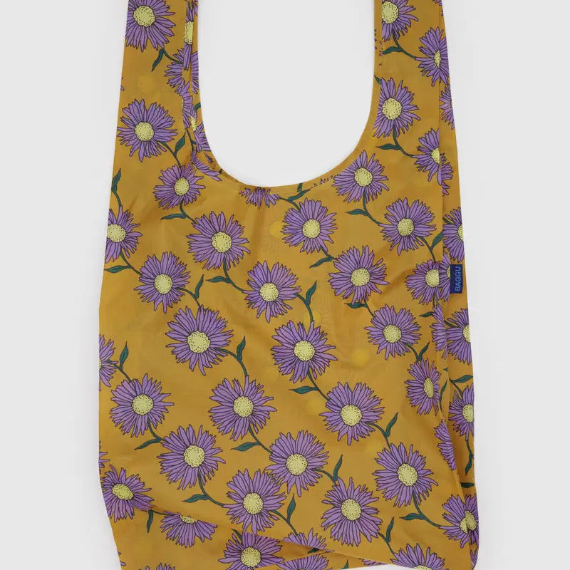 BAGGU Big Bag Reusable bag with purple flower pattern on a mustard yellow background
