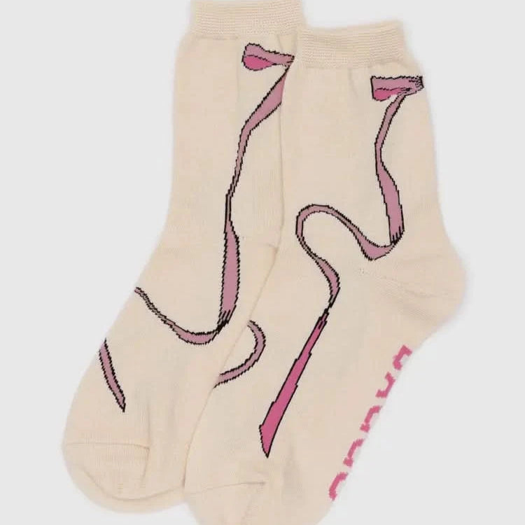 Beige socks with pink flamingo design on a white background