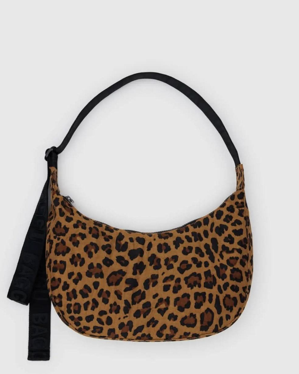 BAGGU leopard print purse with black strap laying flat on a white background
