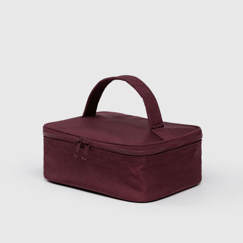 BAGGU-Small-Cosmetic-Case-Maroon travel bag with a handle on a light gray background