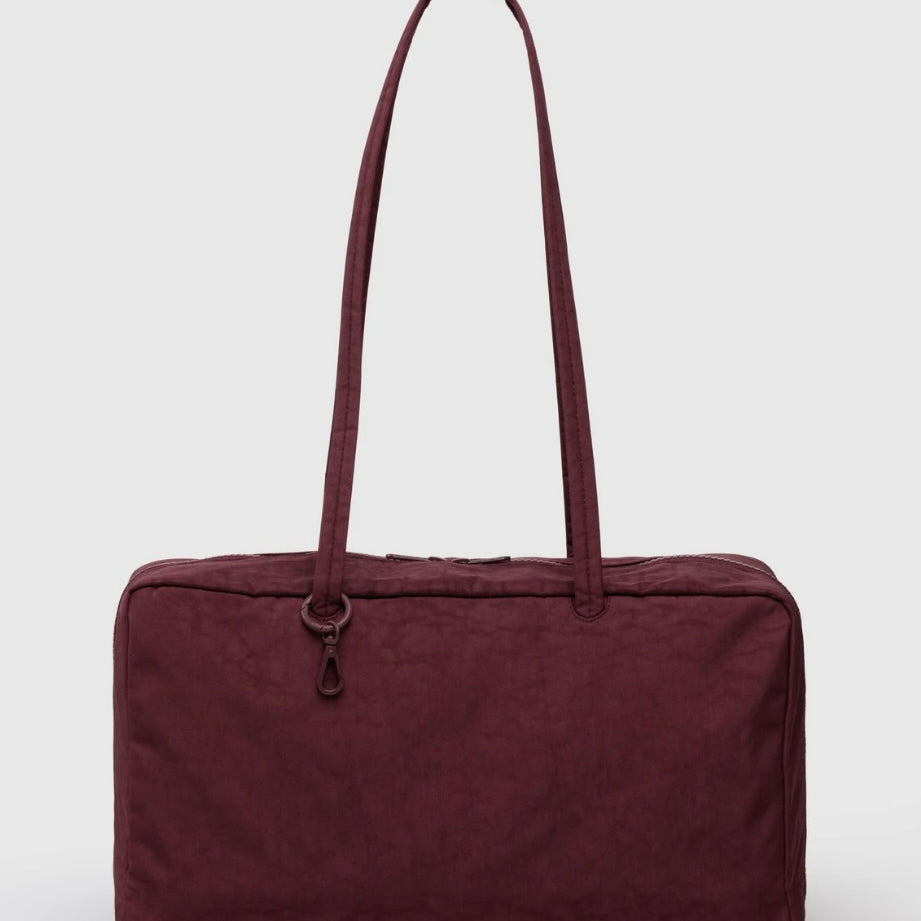 Maroon BAGGU bowler bag with a handle on a white background