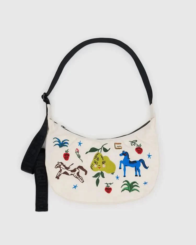 Cream white medium nylon crescent baggu bag with colorful designs including pears, blue horse, plants, flowers, and calico brown horse