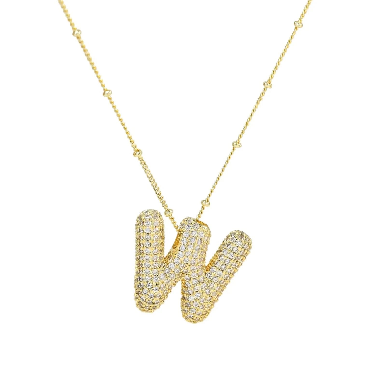 Gold necklace with a letter 'W' pendant on a white background