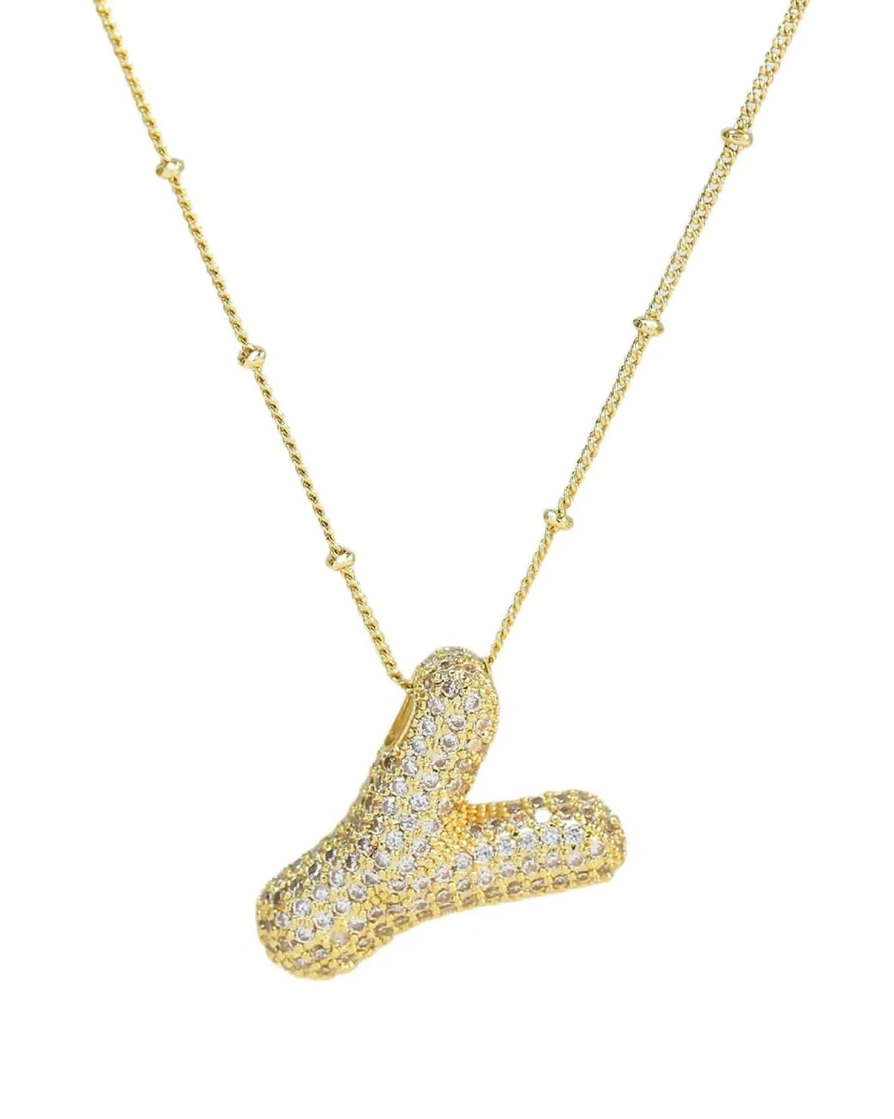 Gold necklace with a unique pendant on a white background
