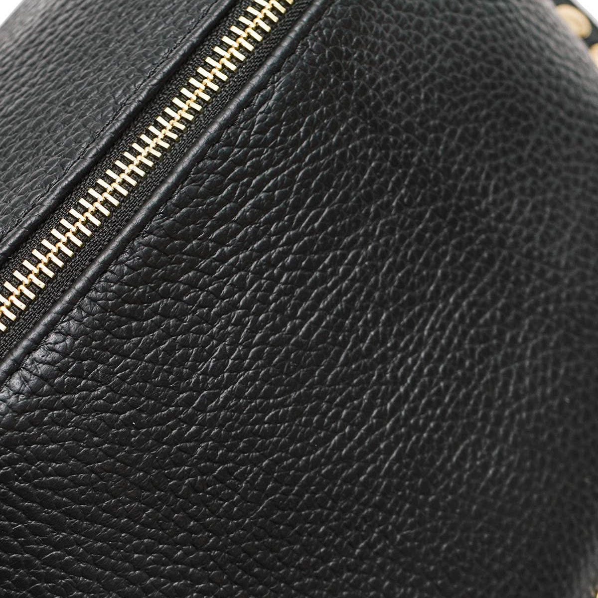 Black leather bag with gold zipper and studs