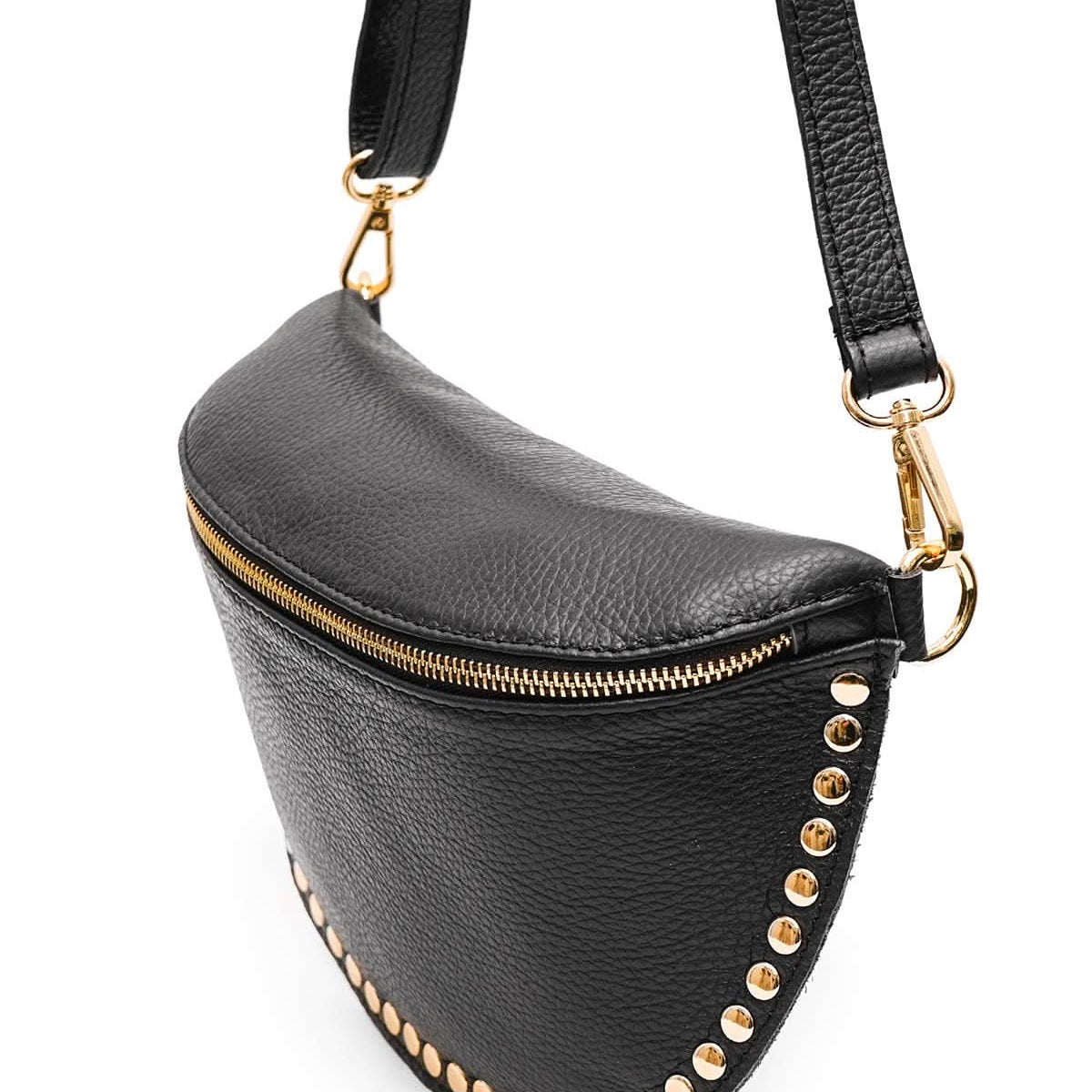 Black fanny pack with gold studs and a strap on a white background