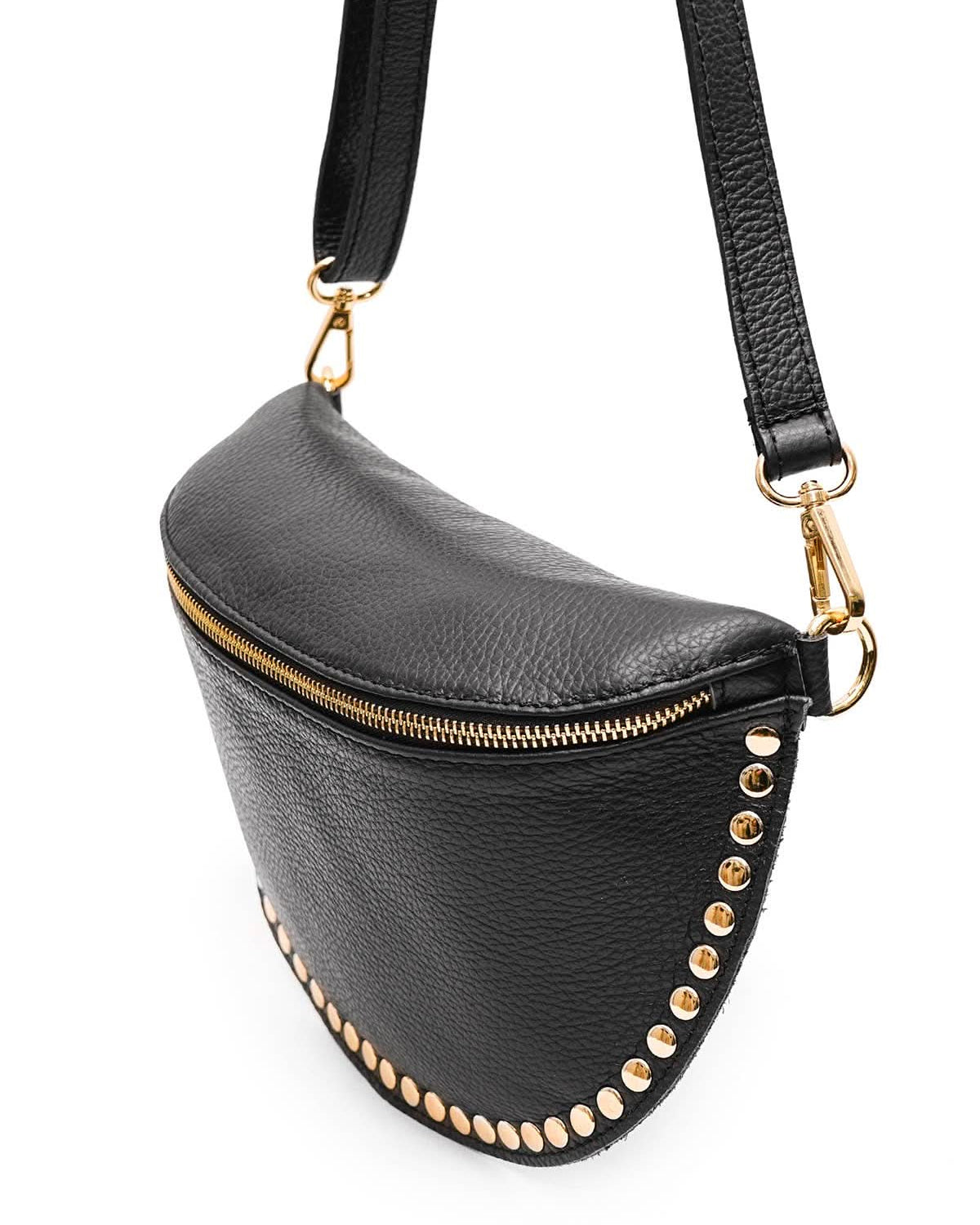 Black fanny pack with gold studs and a strap on a white background