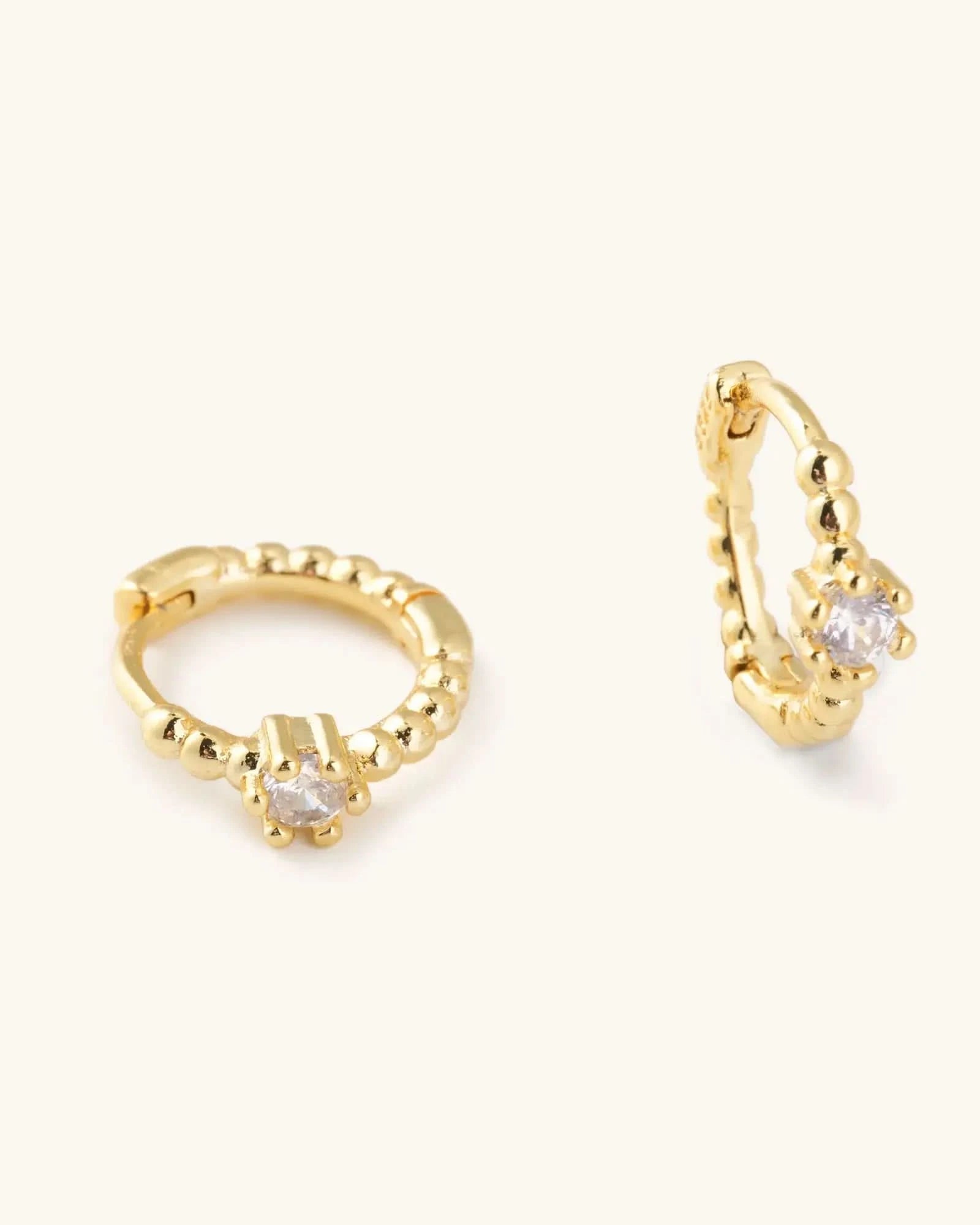 Waterproof gold huggie earrings with single Crystal gem